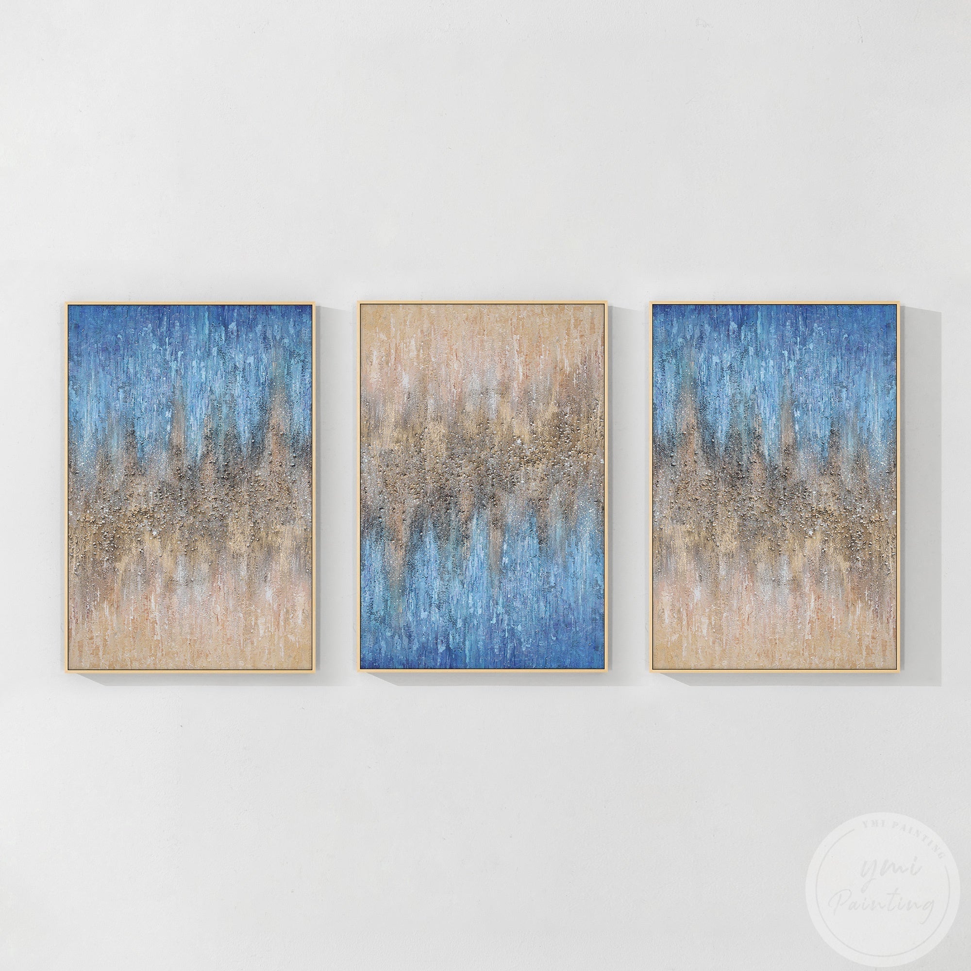 Contemporary abstract 3-piece art set with elegant hues of beige, blue, and striking crystal highlights in wood frame.