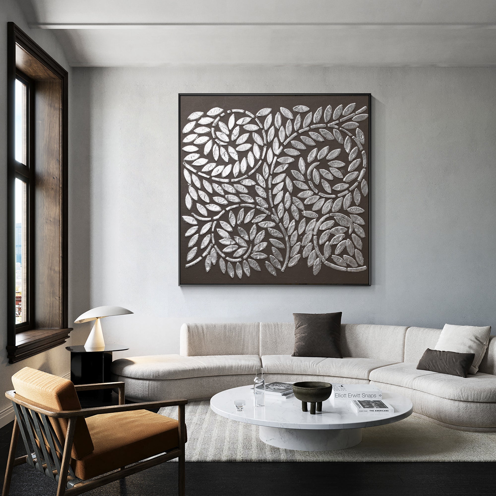 Abstract black and silver tree wall art styled in a modern living room