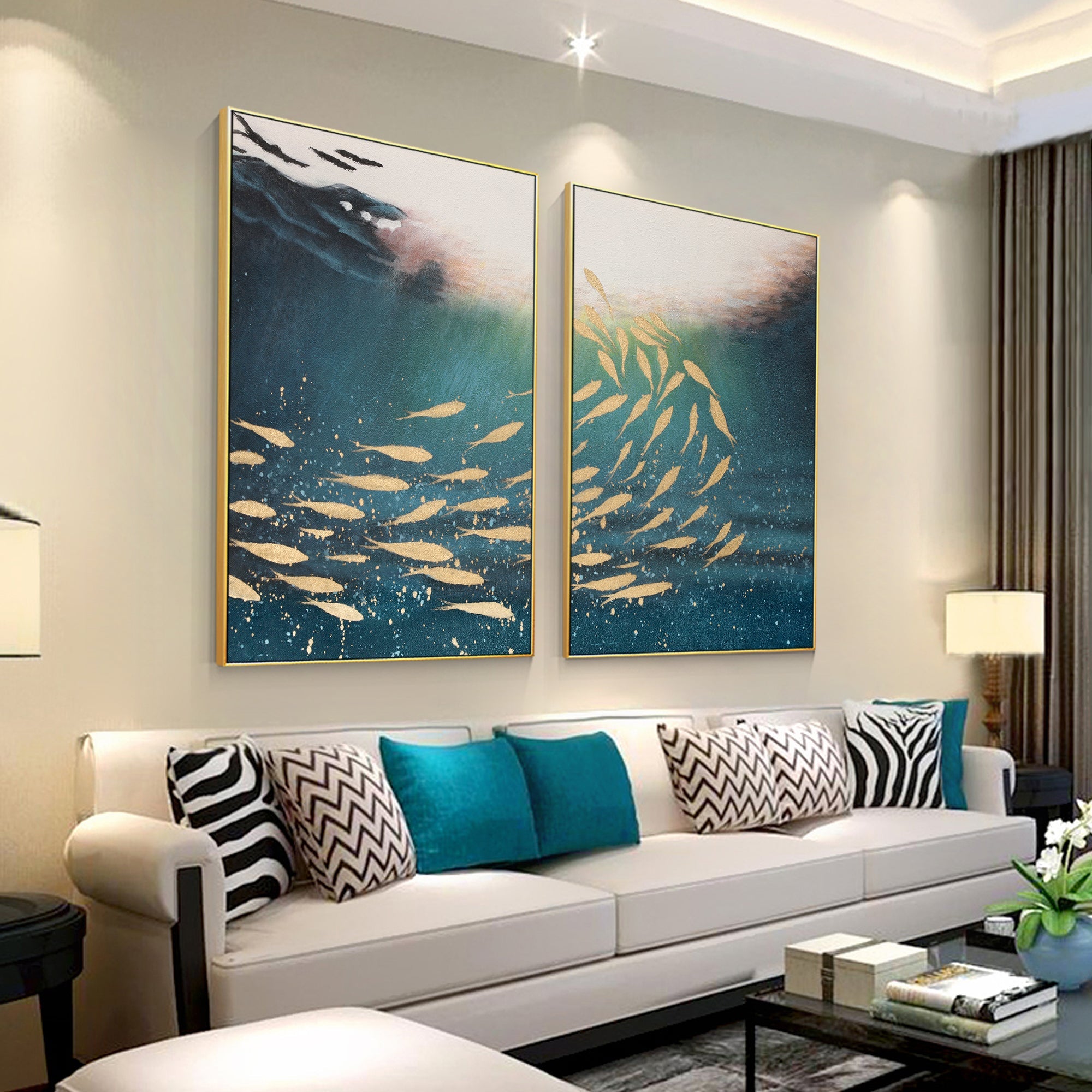 Abstract blue gold fish canvas set of 2 arranged above a sofa in the living room