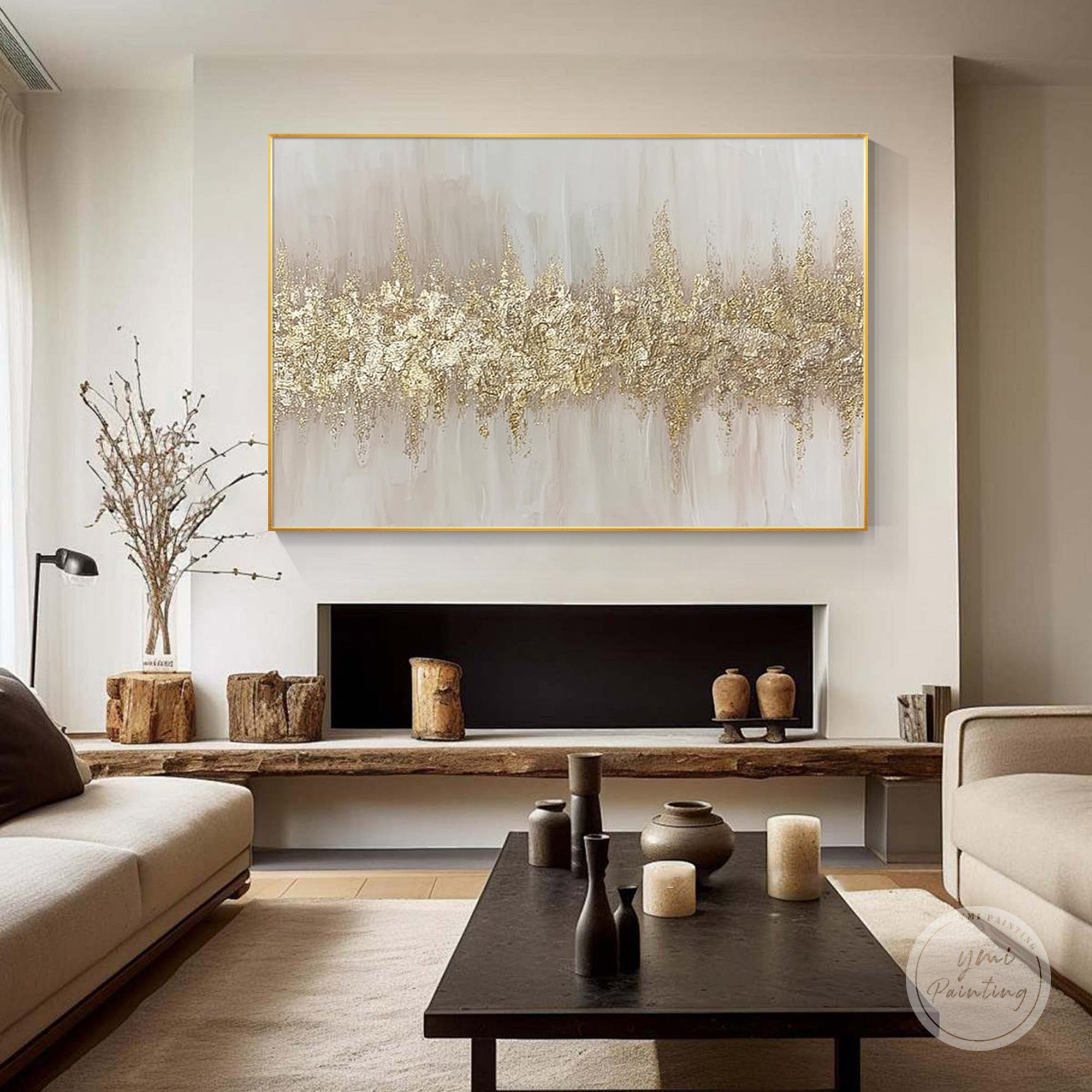 Abstract gold leaf wall art with wide horizontal gold band shown in a modern living room interior.