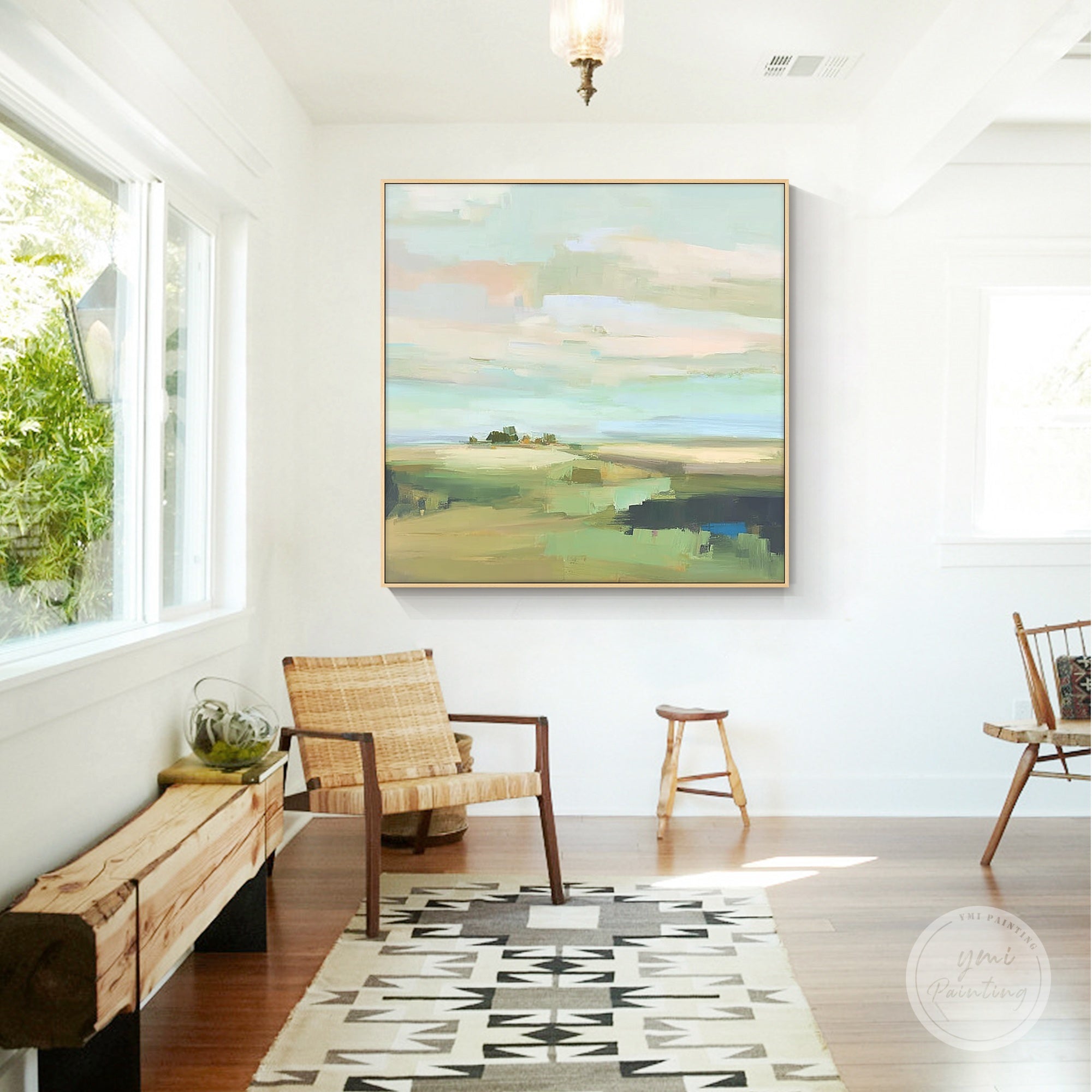 Hand painted abstract pastel landscape painting displayed in a modern living room