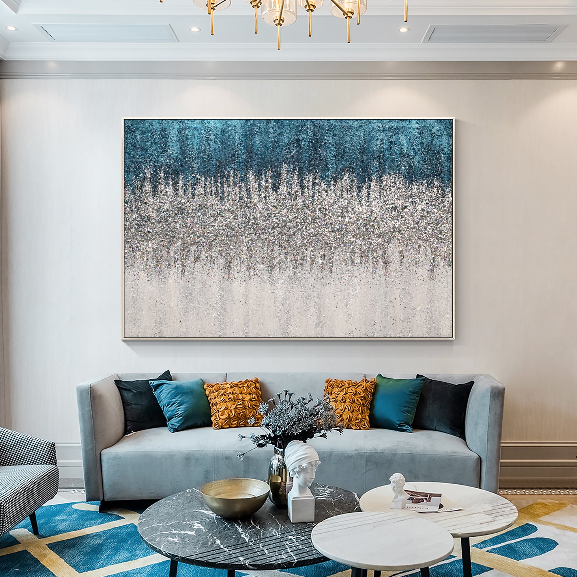 Modern turquoise glitter abstract painting complementing a blue-gray sofa in the living room