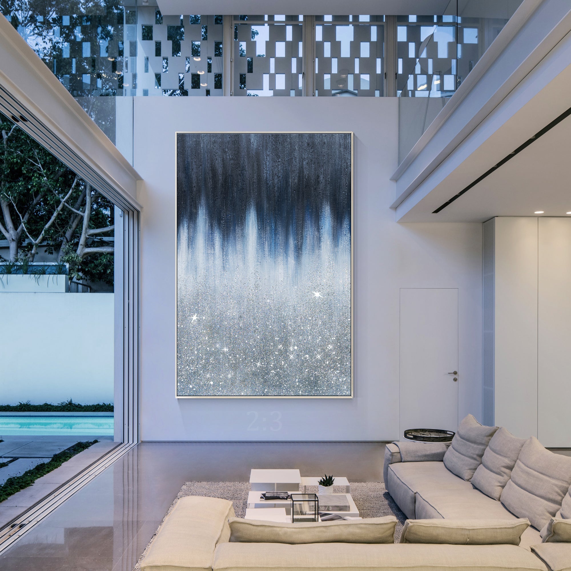 Abstract painting transitioning from black to gray white and silver glitter