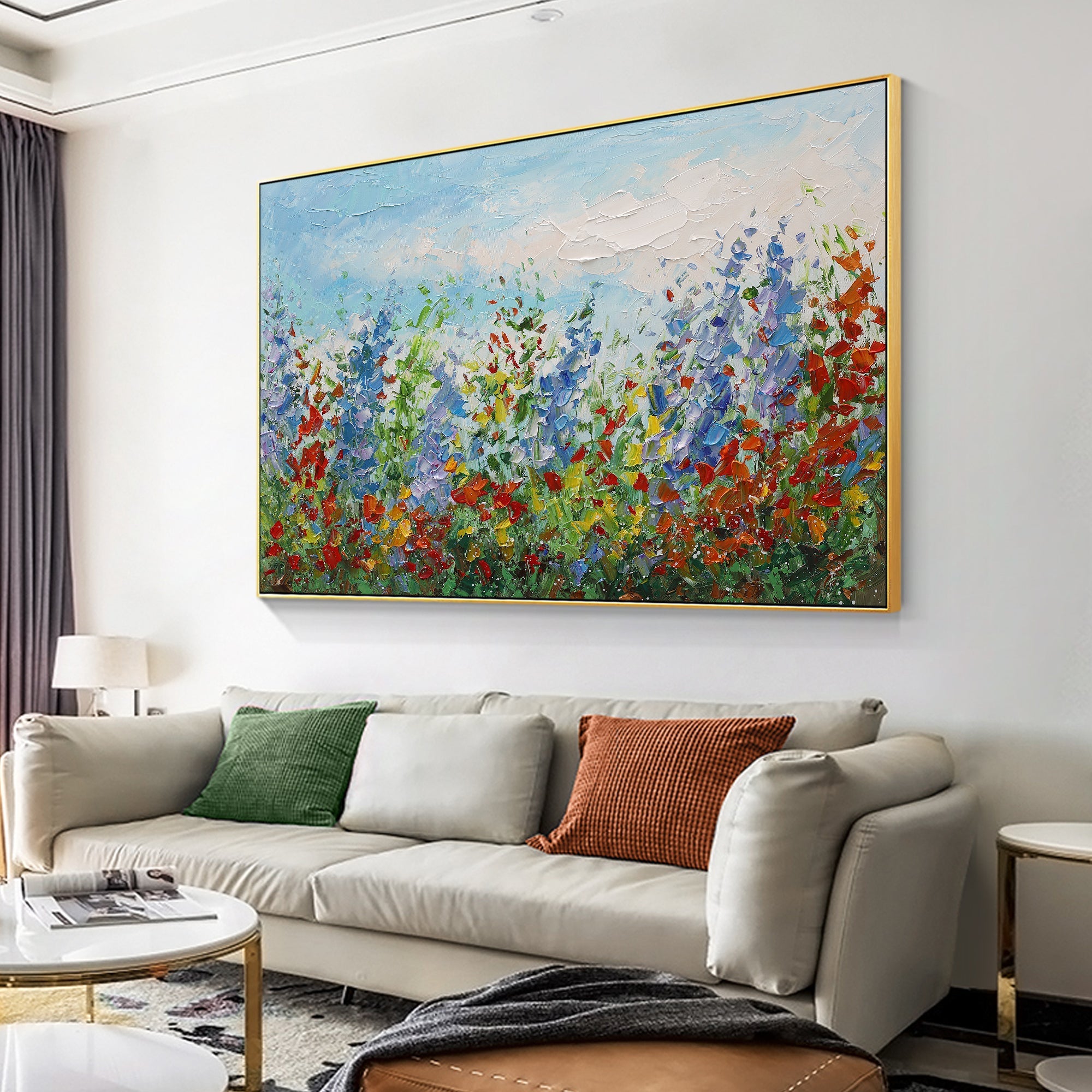 Abstract wild flower painting with blue and red textures above a sofa in the living room