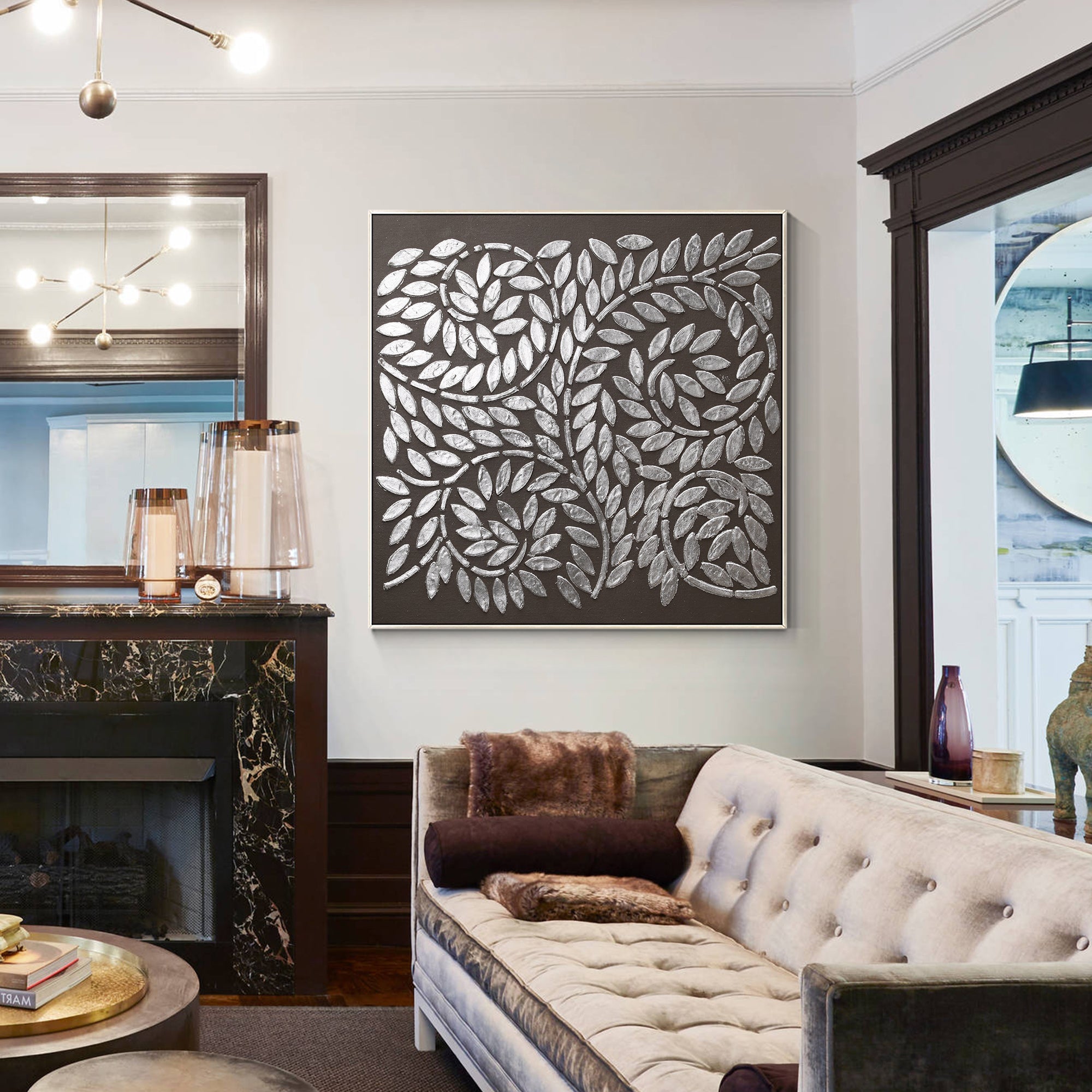 Black and silver bohemian wall art featured in a minimalist living room