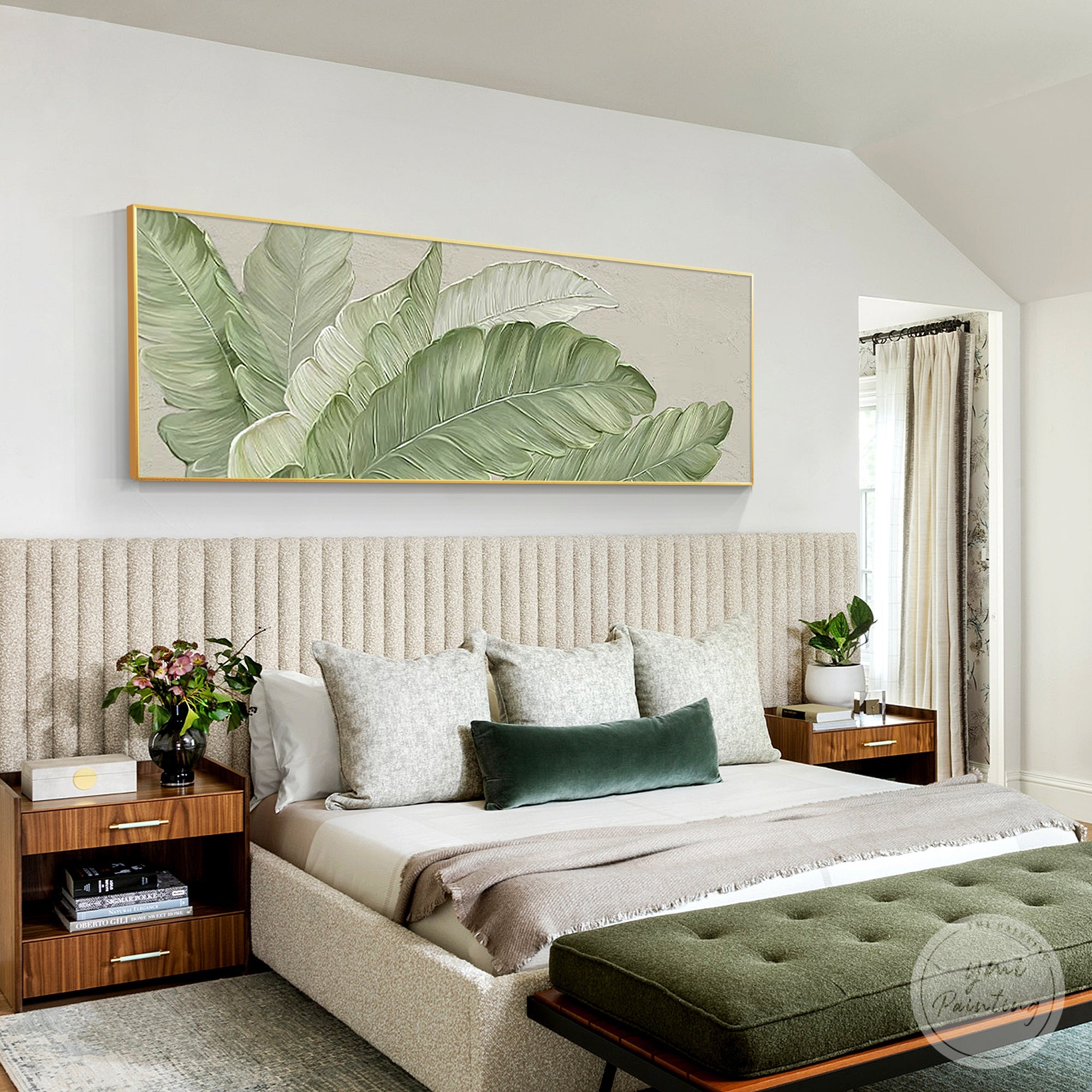 Tropical greenery canvas art hung above a bedroom bed