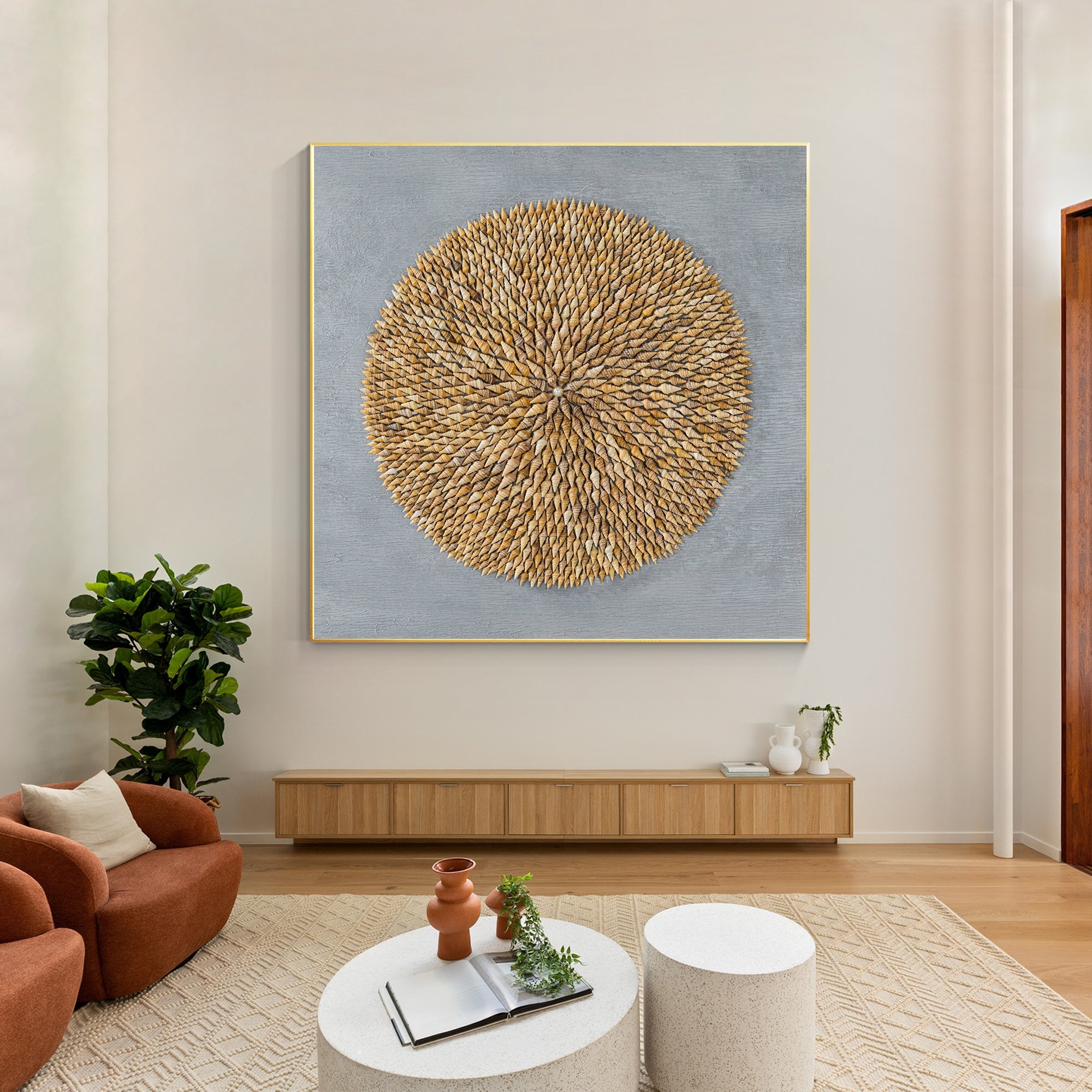 Coastal-themed shell wall art with pearl at center and textured shell design.