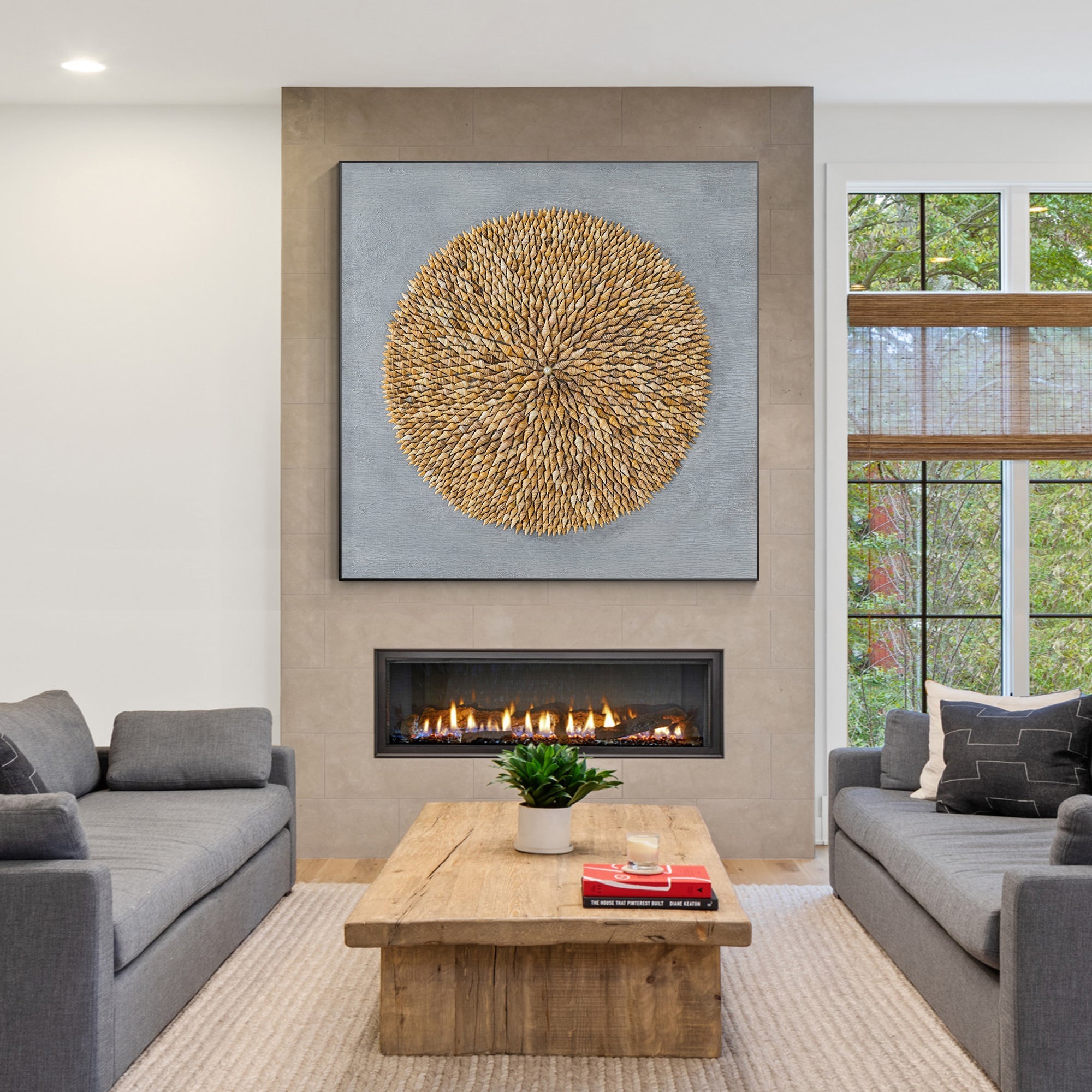 Handcrafted shell art with spiral pattern and pearl, adding refined beauty to any space.