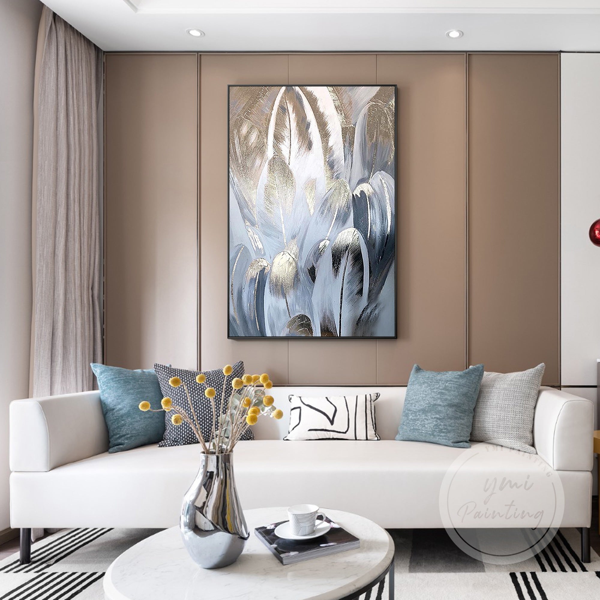 Large framed feather wall art, a perfect blend of soft metallic rose gold and cool blue hues.