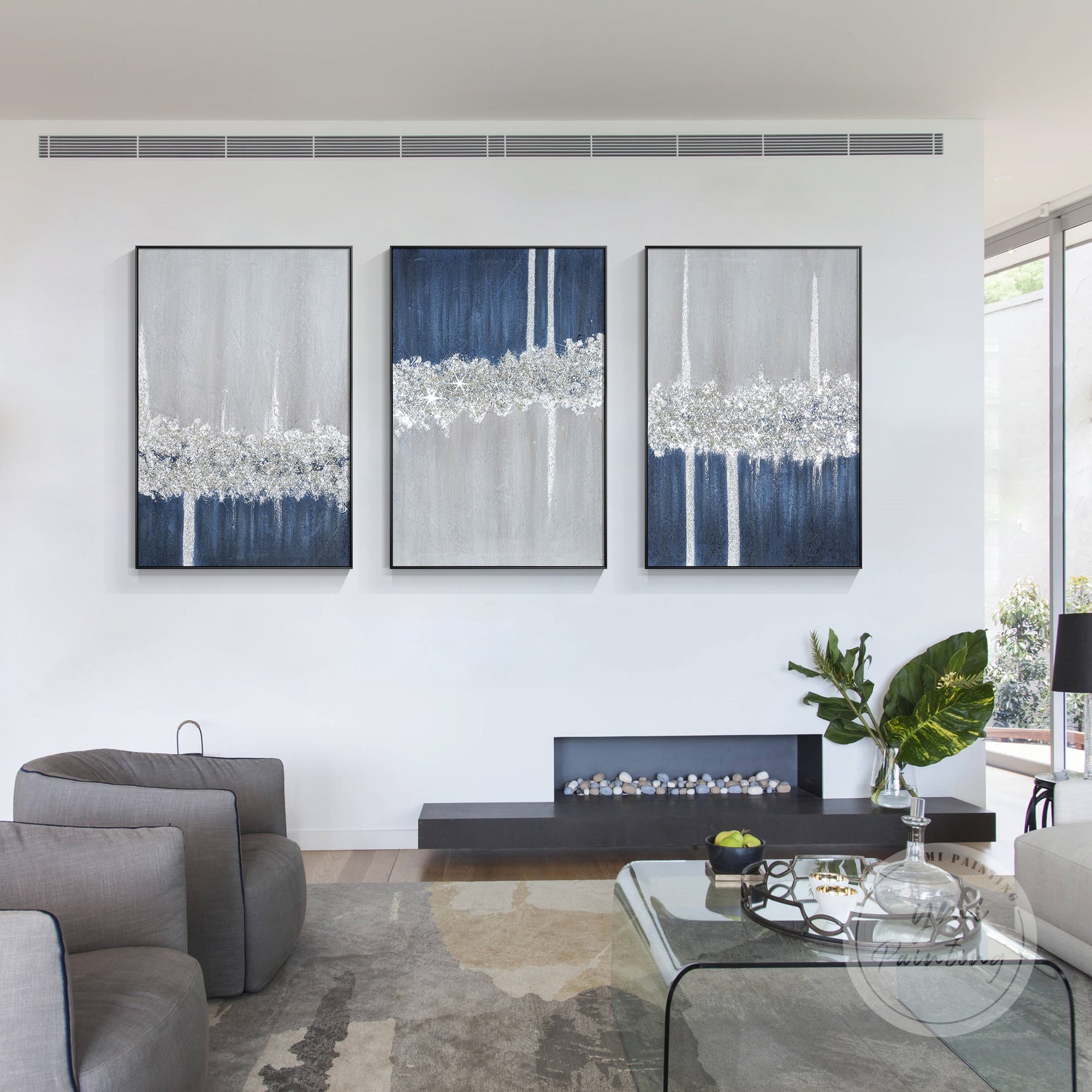 Three-part glitter painting with navy and silver tones, creating a unique and sophisticated wall display.