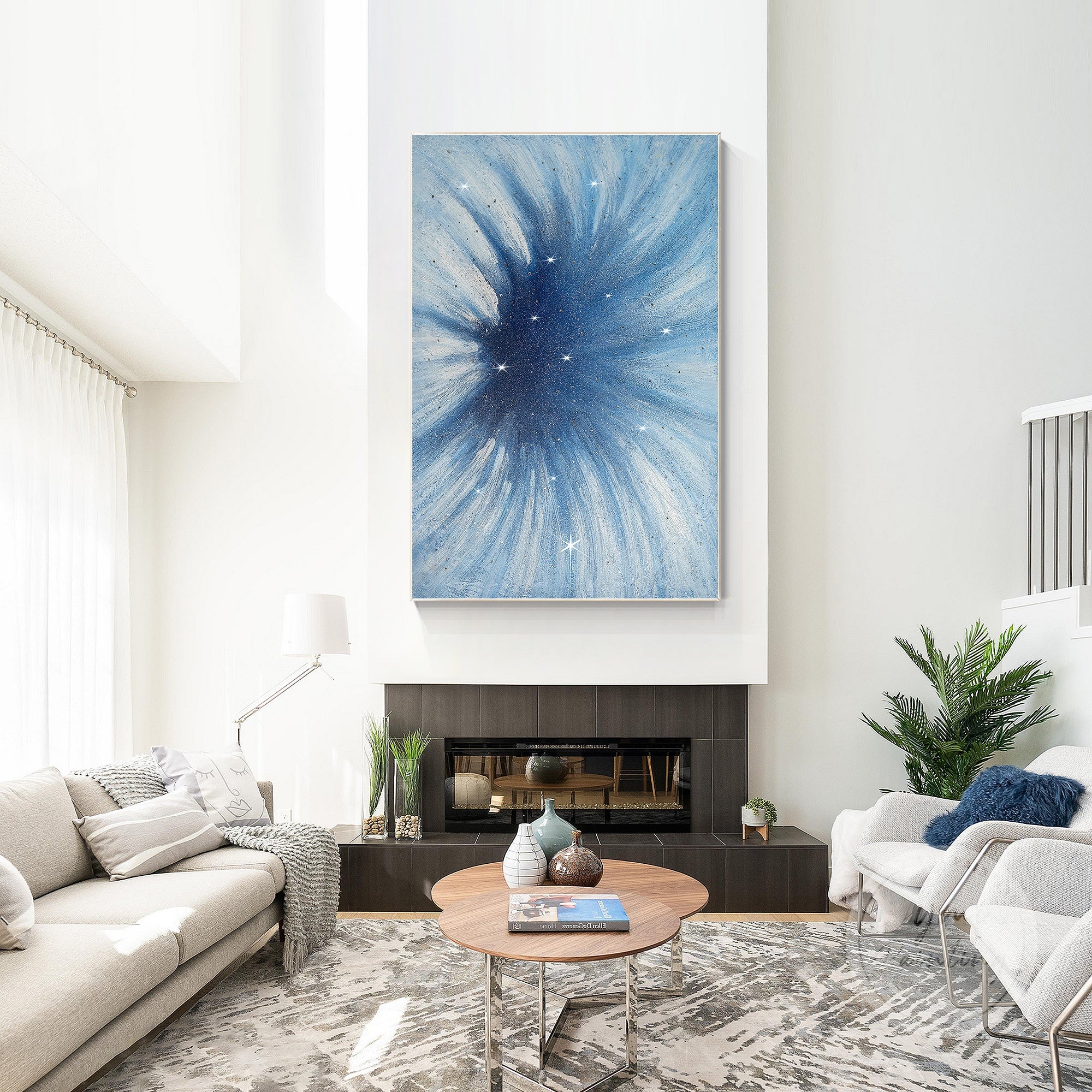 Glam wall art featuring sparkling blue floral painting displayed above a velvet sofa.