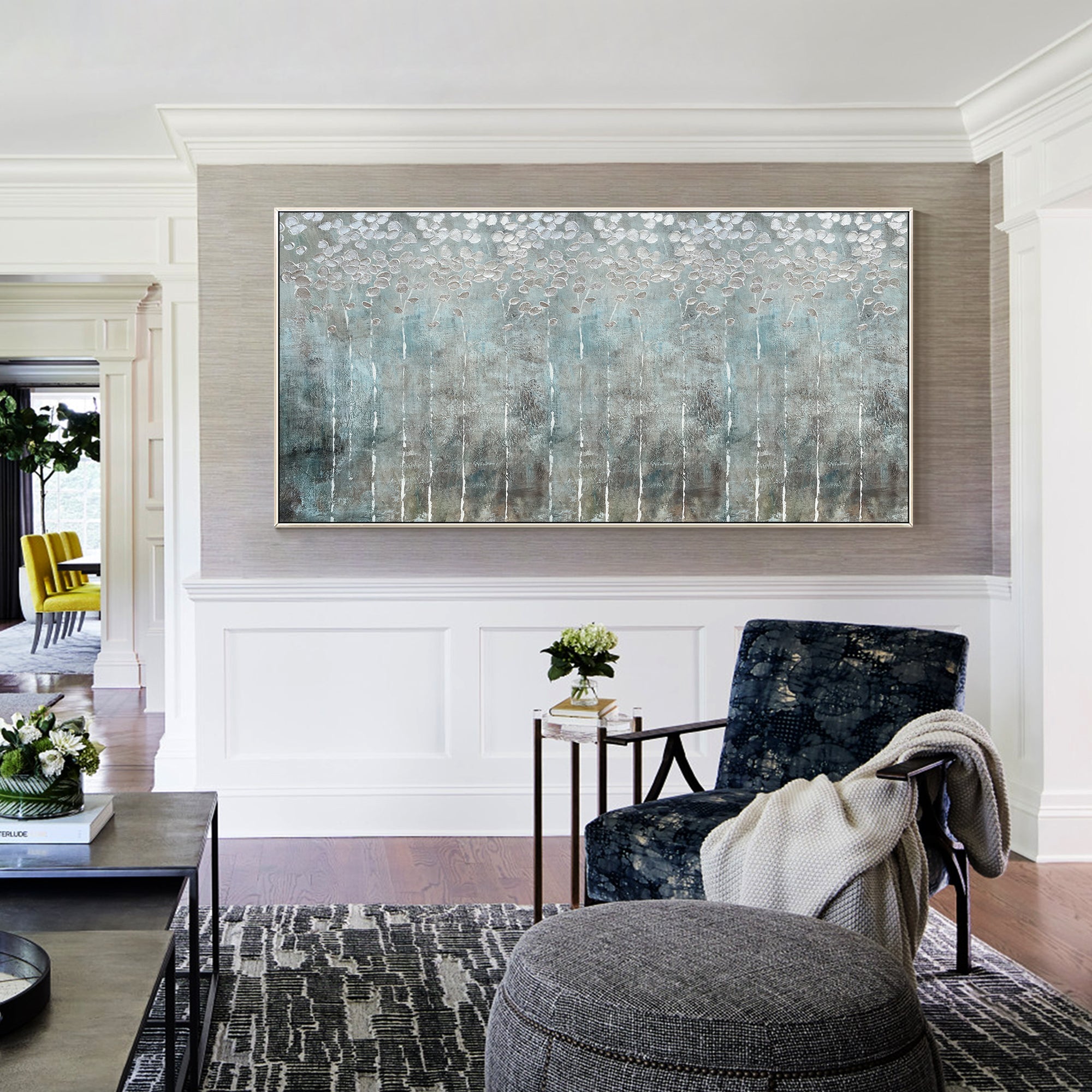 Abstract wall art in gray and silver colors showcasing rich texture and layered paint detail