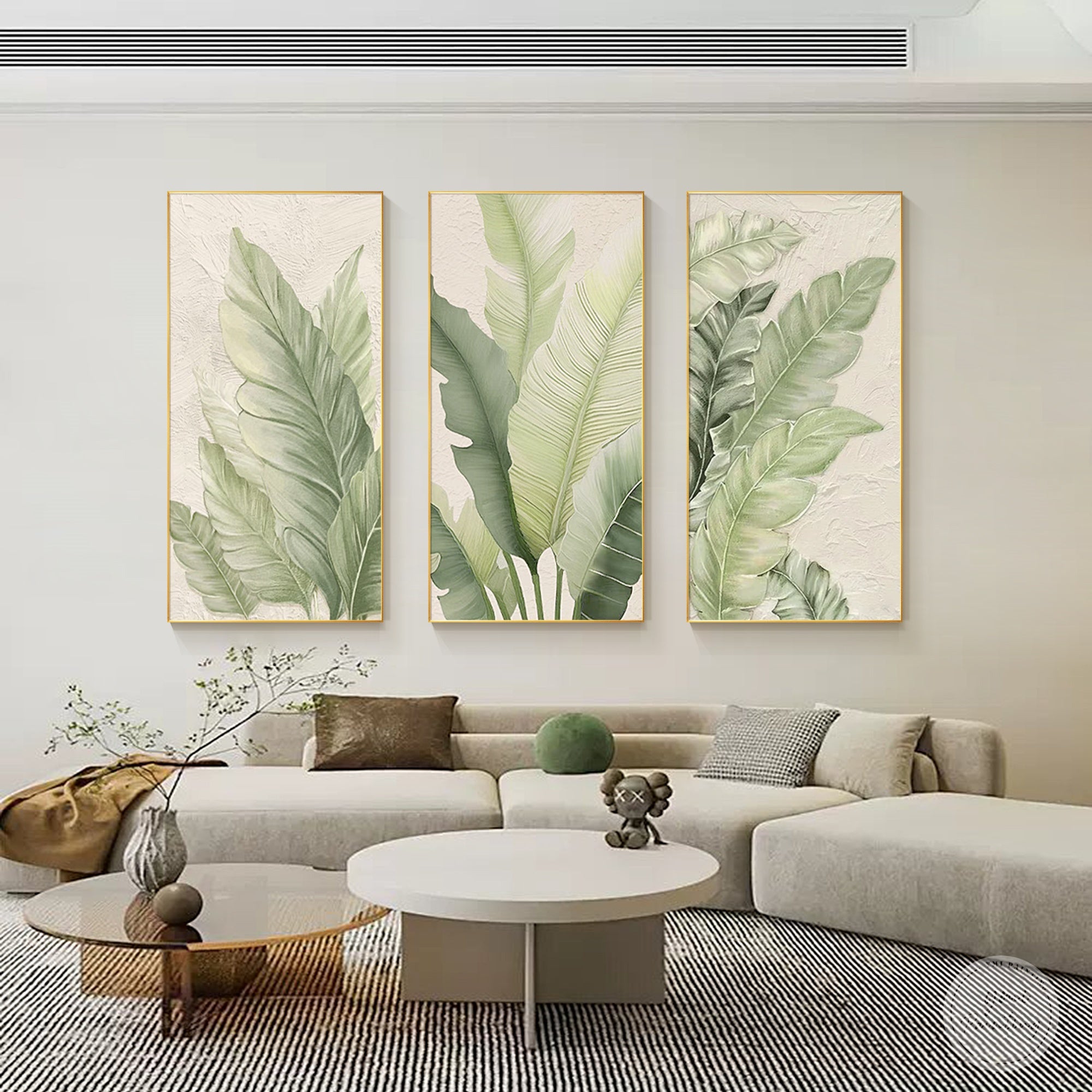 Leaf print wall decor set styled in a bright living room interior