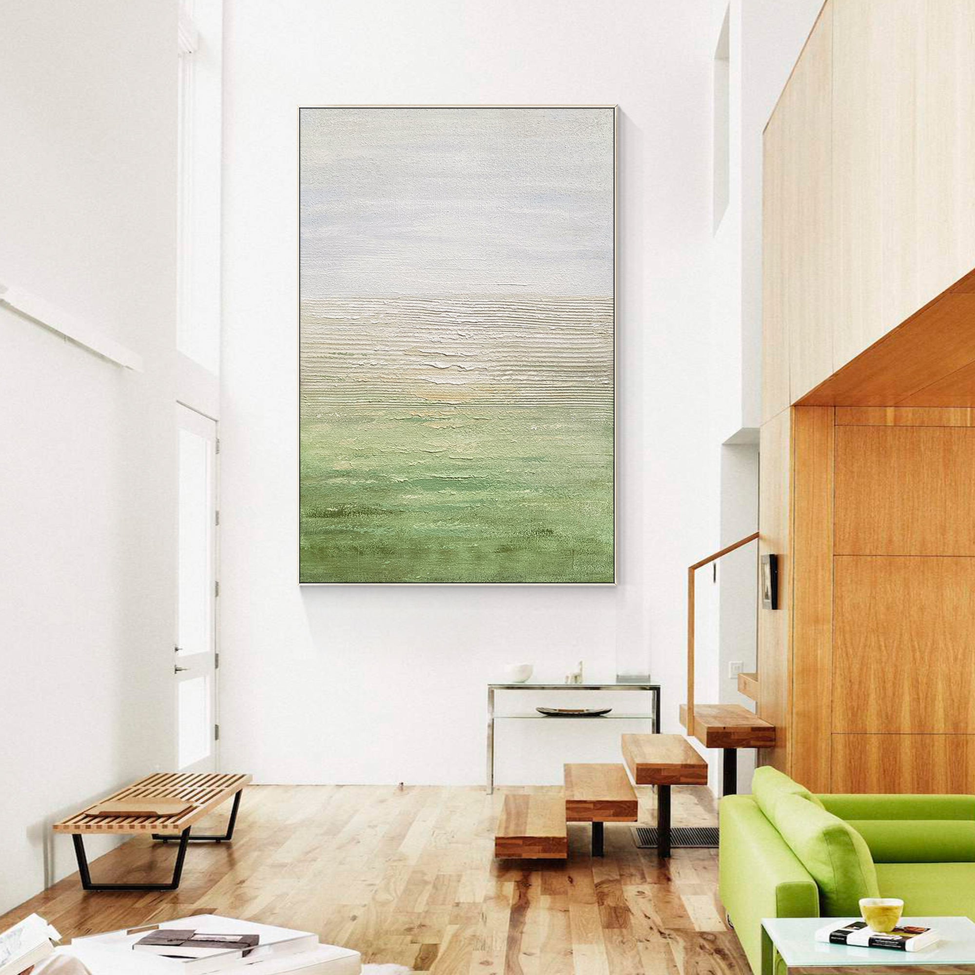 Green abstract wall painting with a rich textured surface in a modern living room.