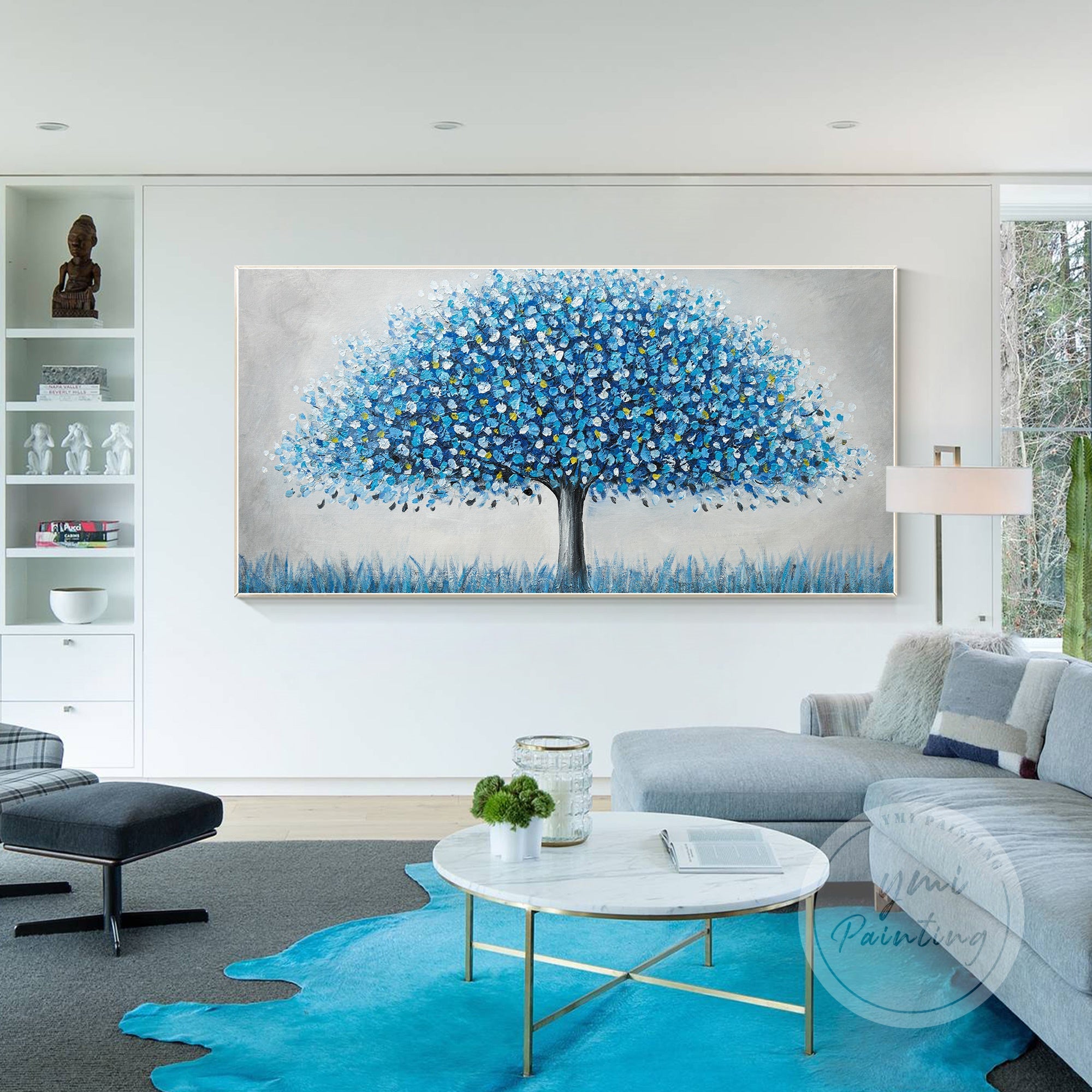"Blue tree artwork with yellow and green accents on white background"