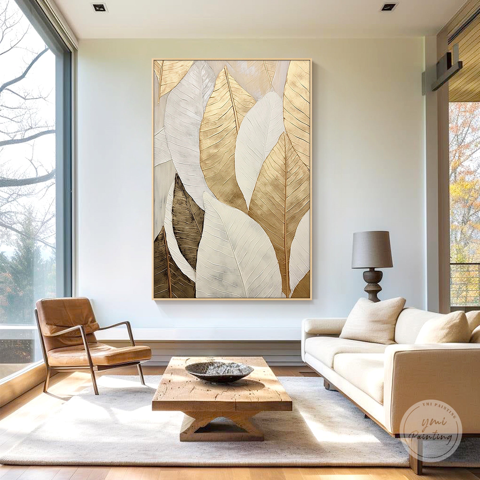 Modern botanical leaf wall art styled above a sofa in a living room