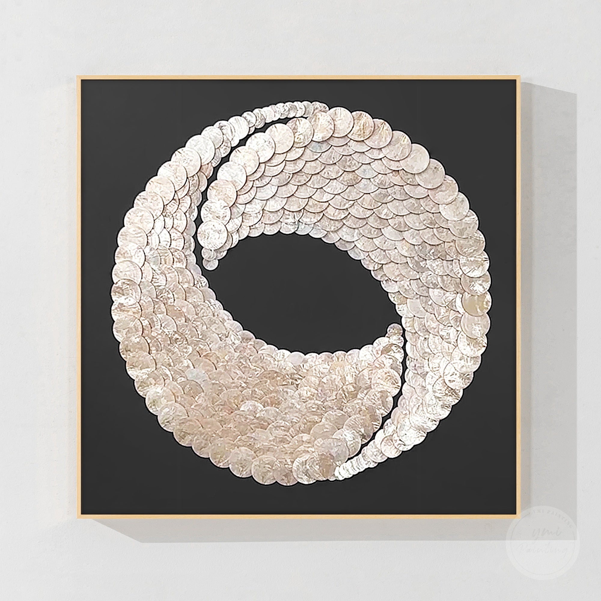 Handmade white capiz shell wall art with circular 3D textured design