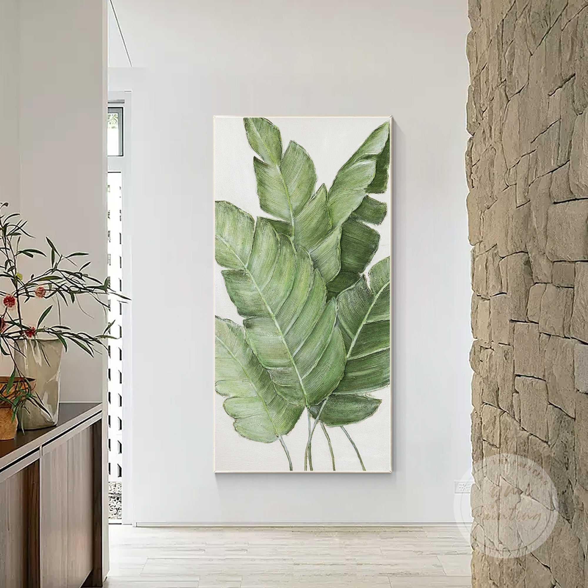 Contemporary green wall decor featuring abstract leaves and layered textures.