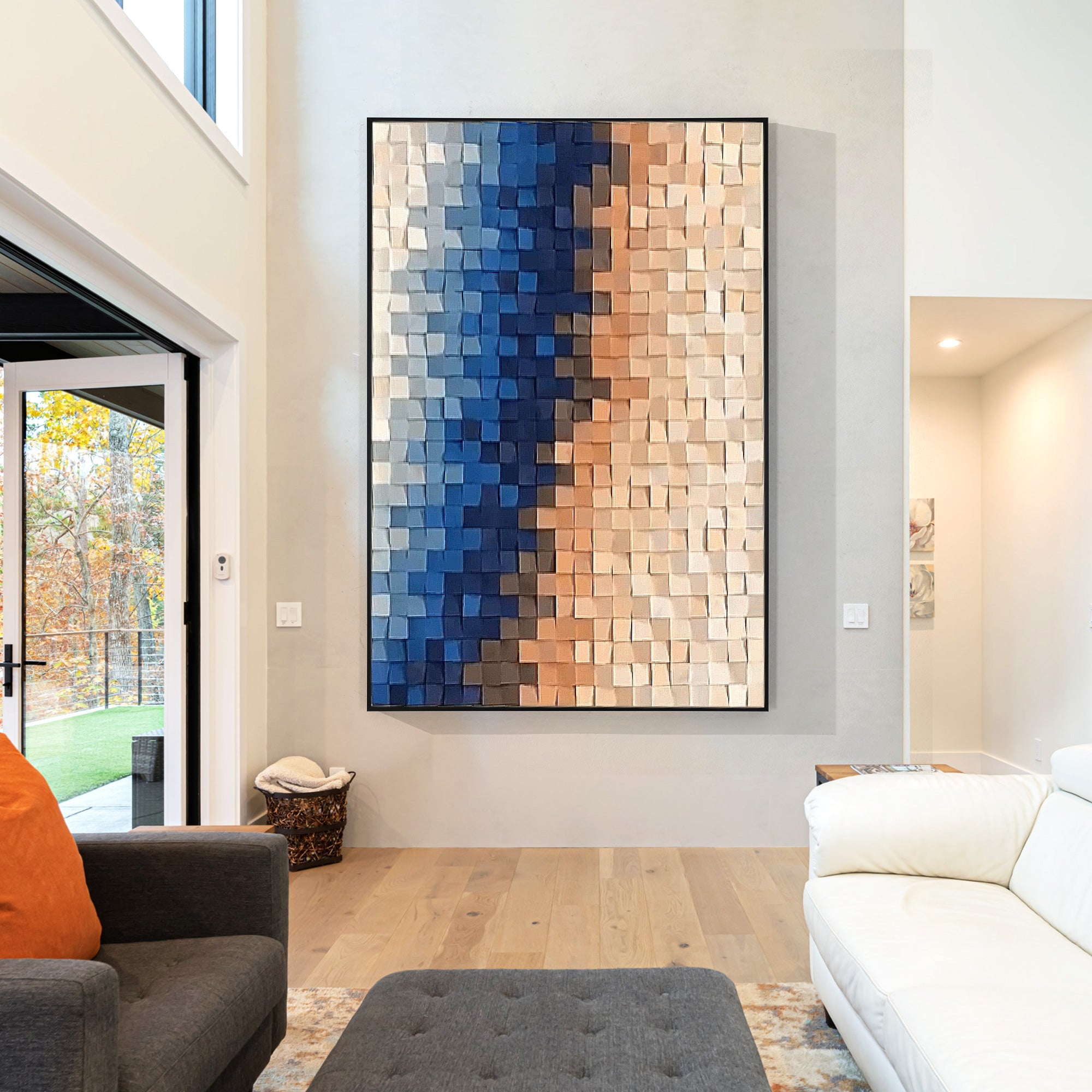 Abstract wall art featuring small wooden squares in blue and peach, layered to create a dynamic color gradient.
