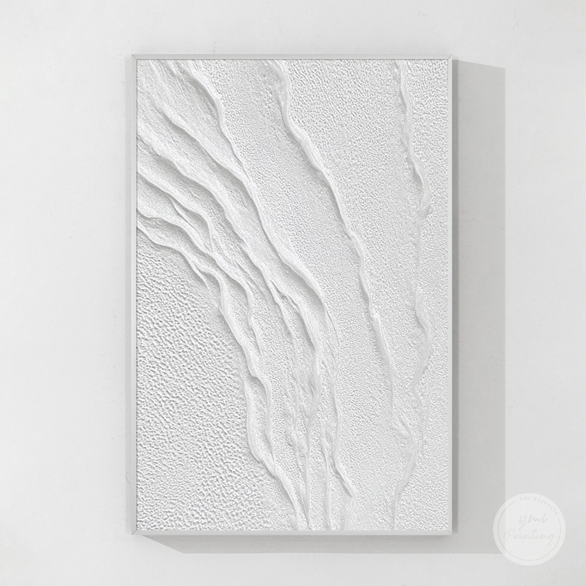 White textured abstract wall art above a beige sofa in a modern minimalist living room