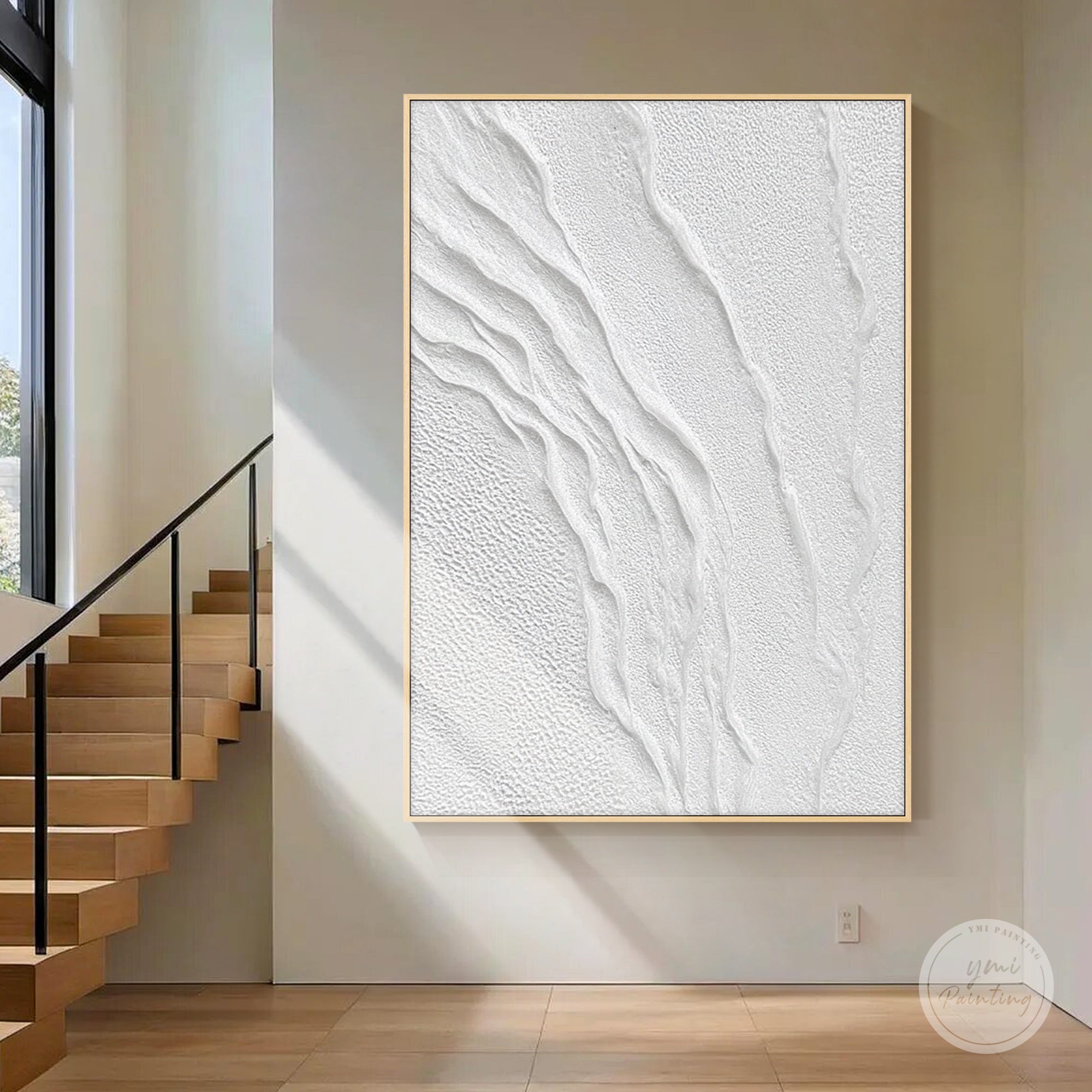 Vertical white relief wall art in a Japandi entryway with natural linen decor