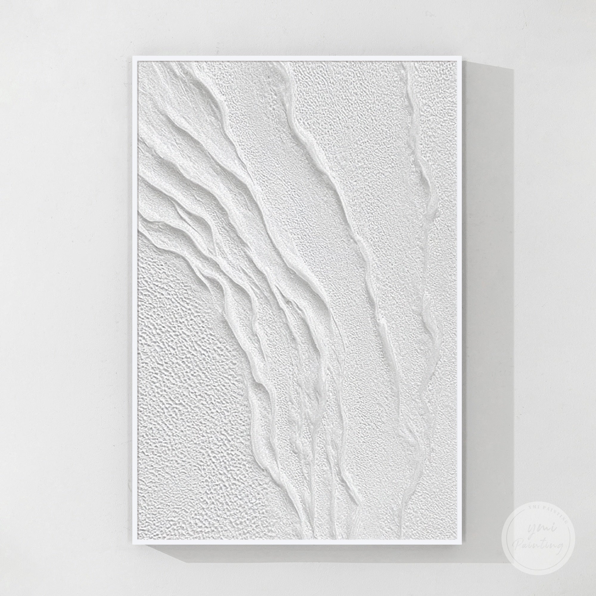 Vertical plaster texture wall art styled in a modern organic home with cream and wood accents