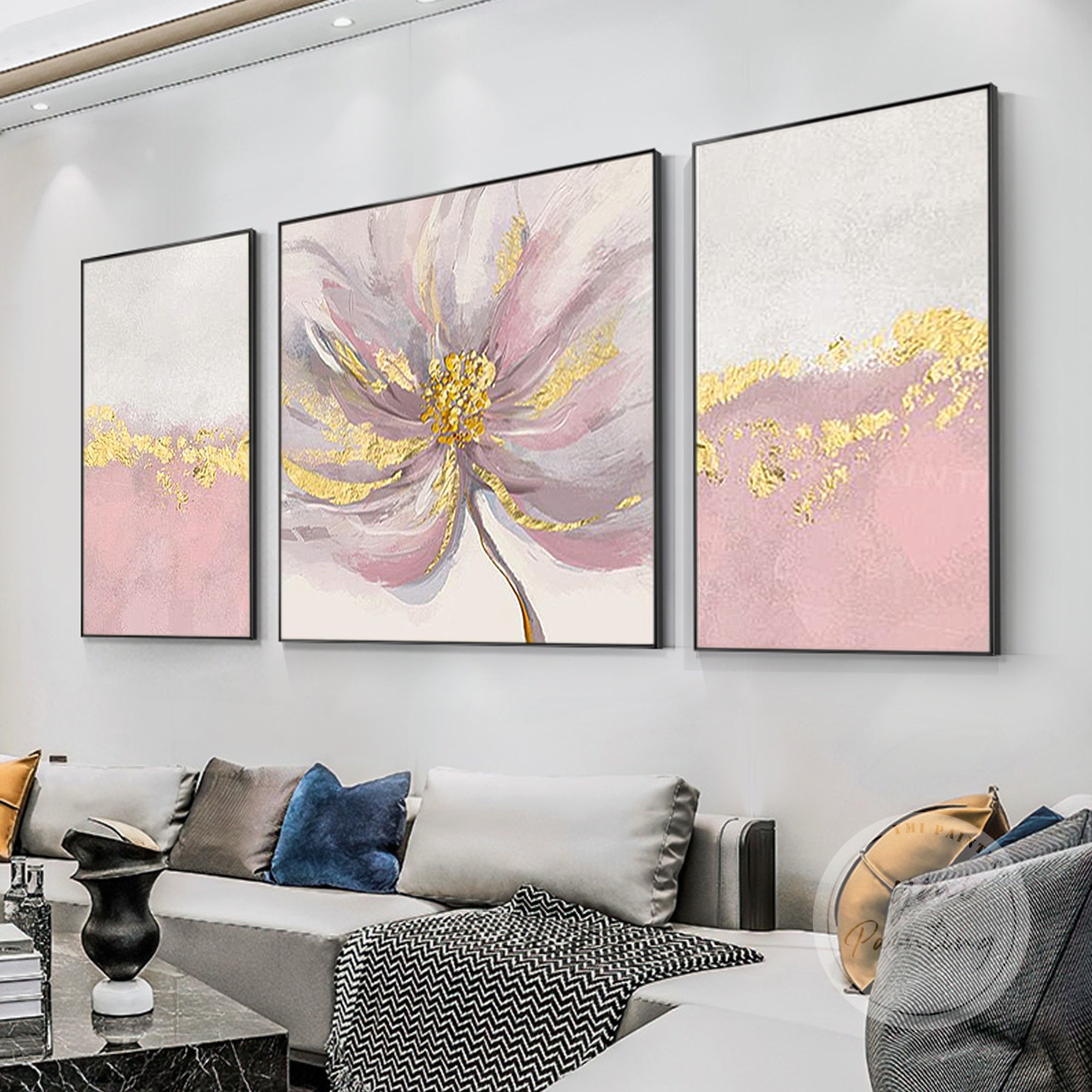 Featuring soft pink and gray hues with gold accents, this 3-piece abstract floral wall art creates a warm and elegant ambiance for bedrooms.