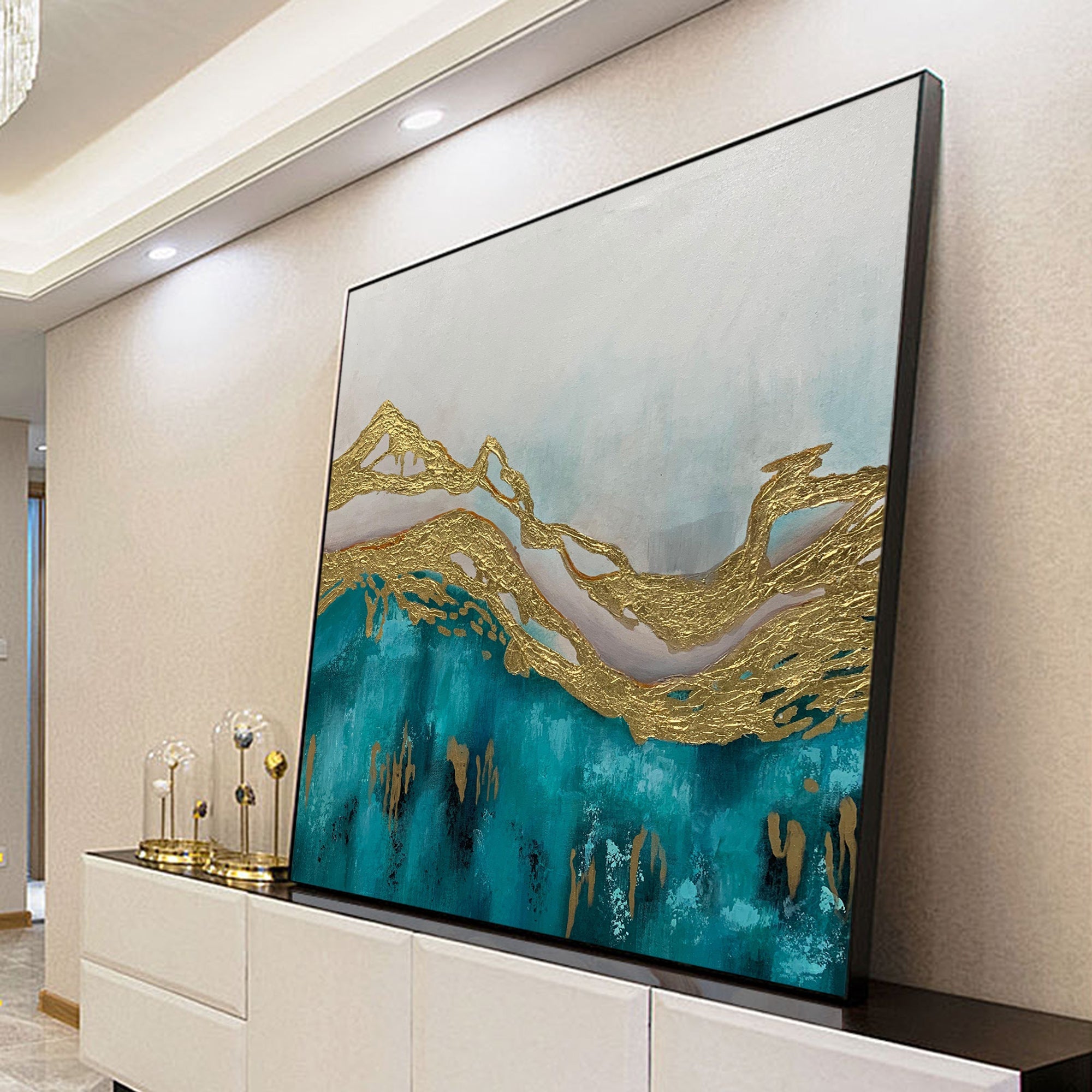 Turquoise gold abstract mountain wall art styled on a living room wall