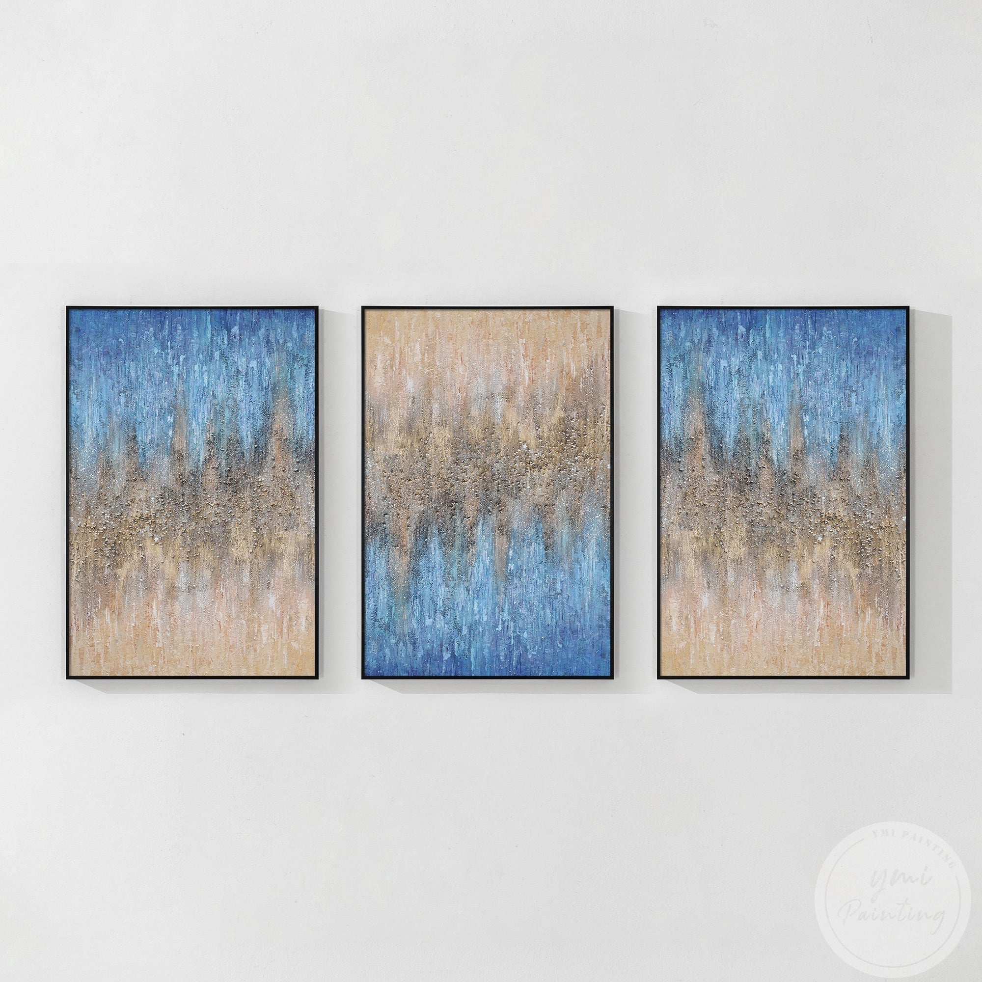 Elegant 3-piece artwork with a prismatic interplay of beige, blue, and shimmering gold, adding sophistication to any space with a black frame.
