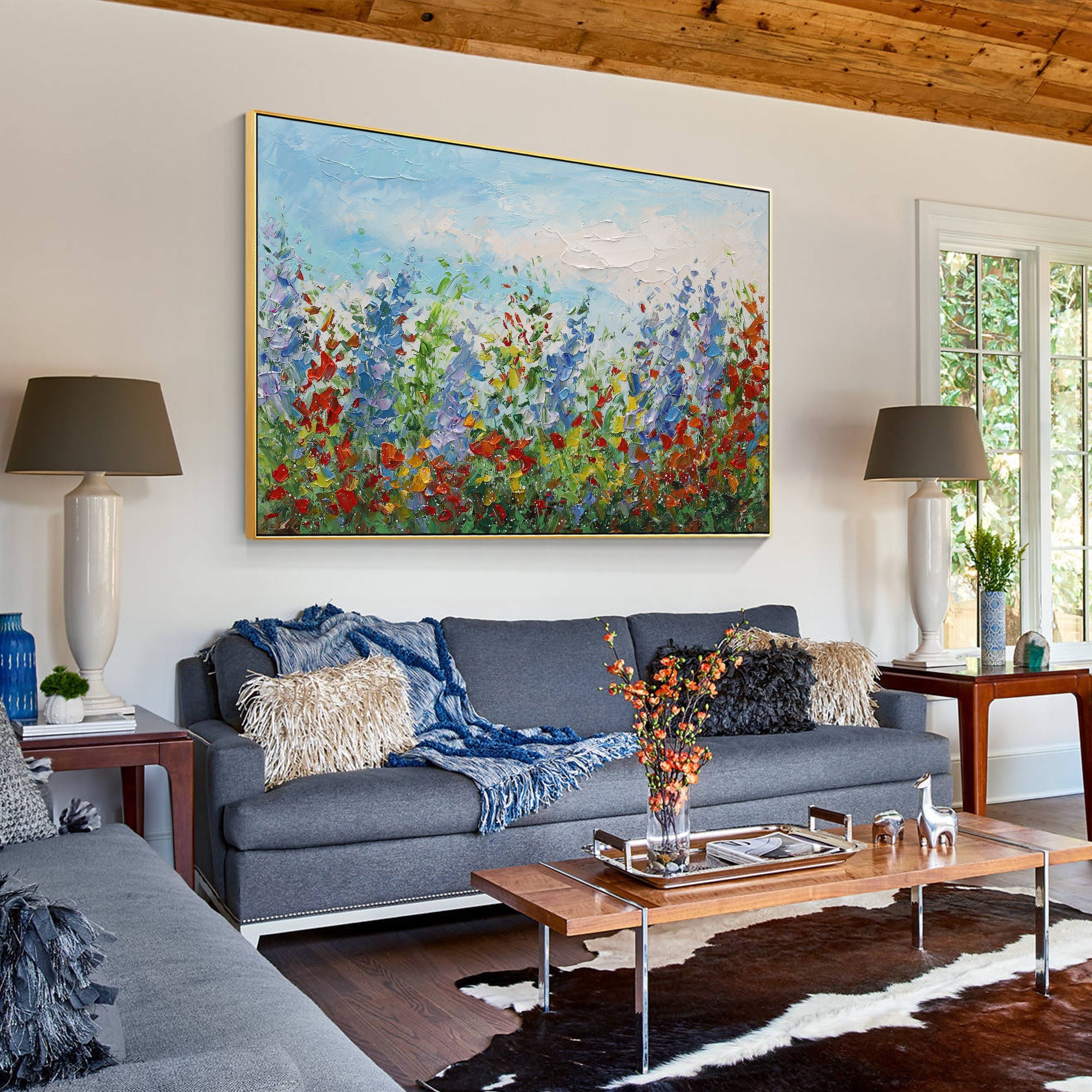 Modern blue red floral abstract wall art styled on a living room wall