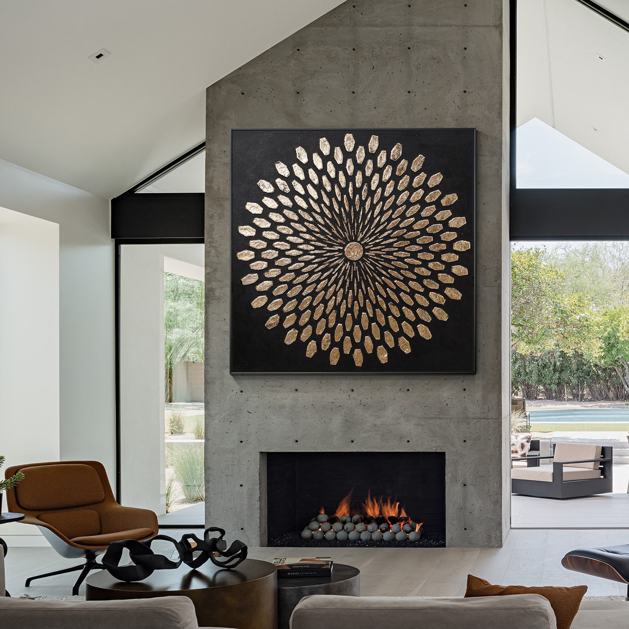 Black and gold abstract wall art styled in a minimalist living room interior