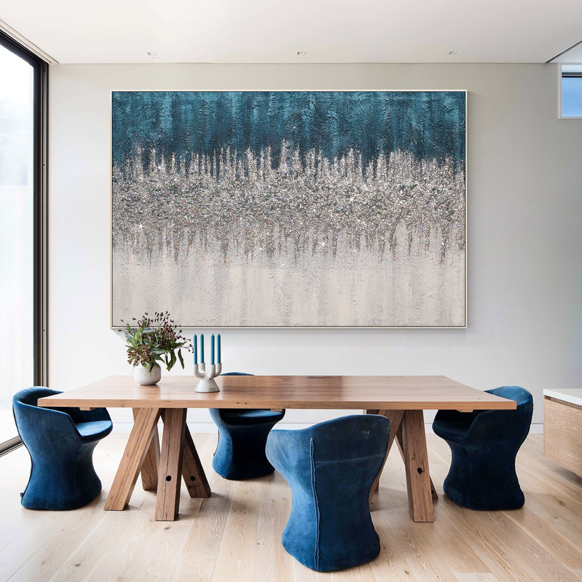 Turquoise glitter abstract wall art in a meeting room with blue velvet chairs
