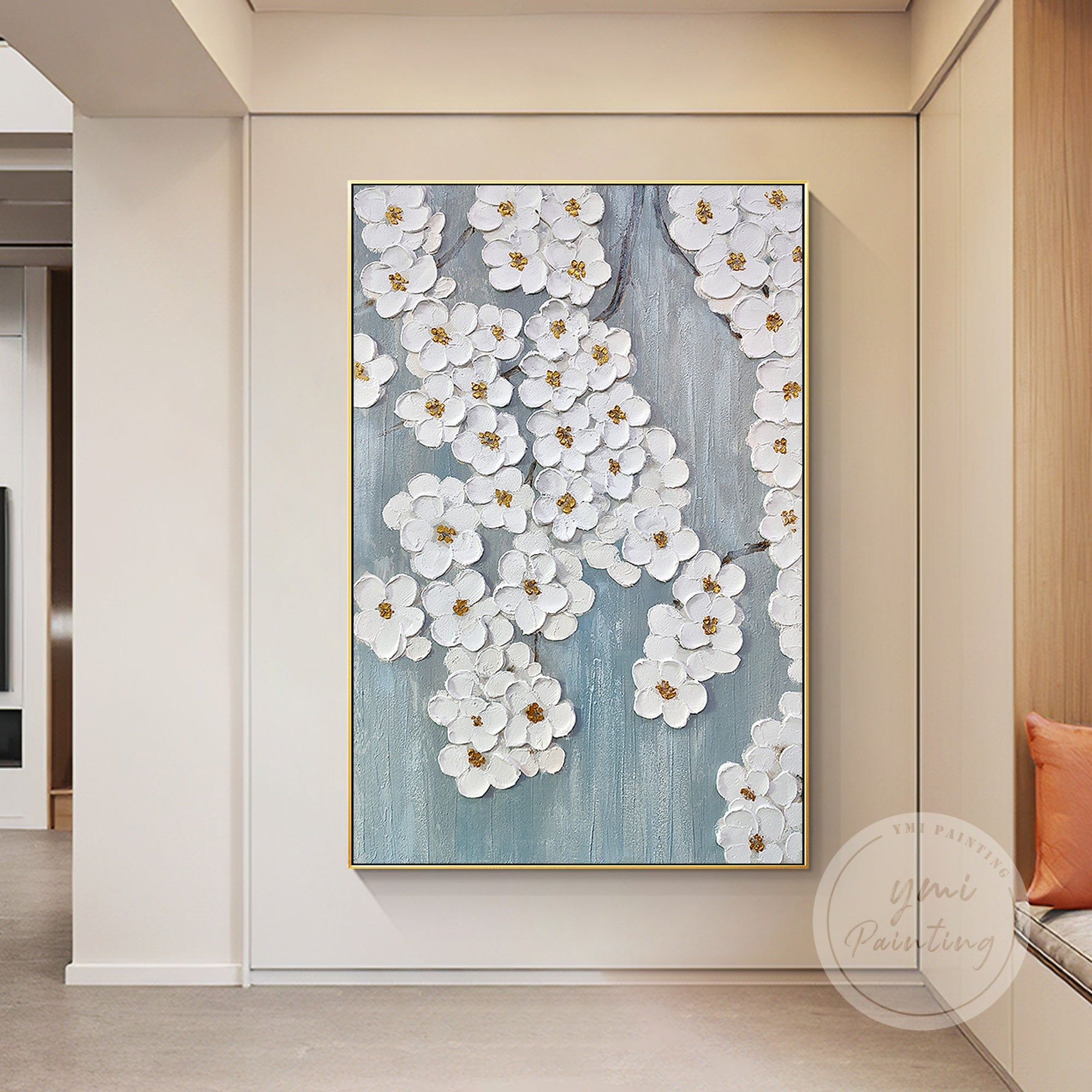 This modern floral wall art, showcasing flower blossoms with textured brushstrokes and gold accents, adds sophistication and tranquility to your living room.