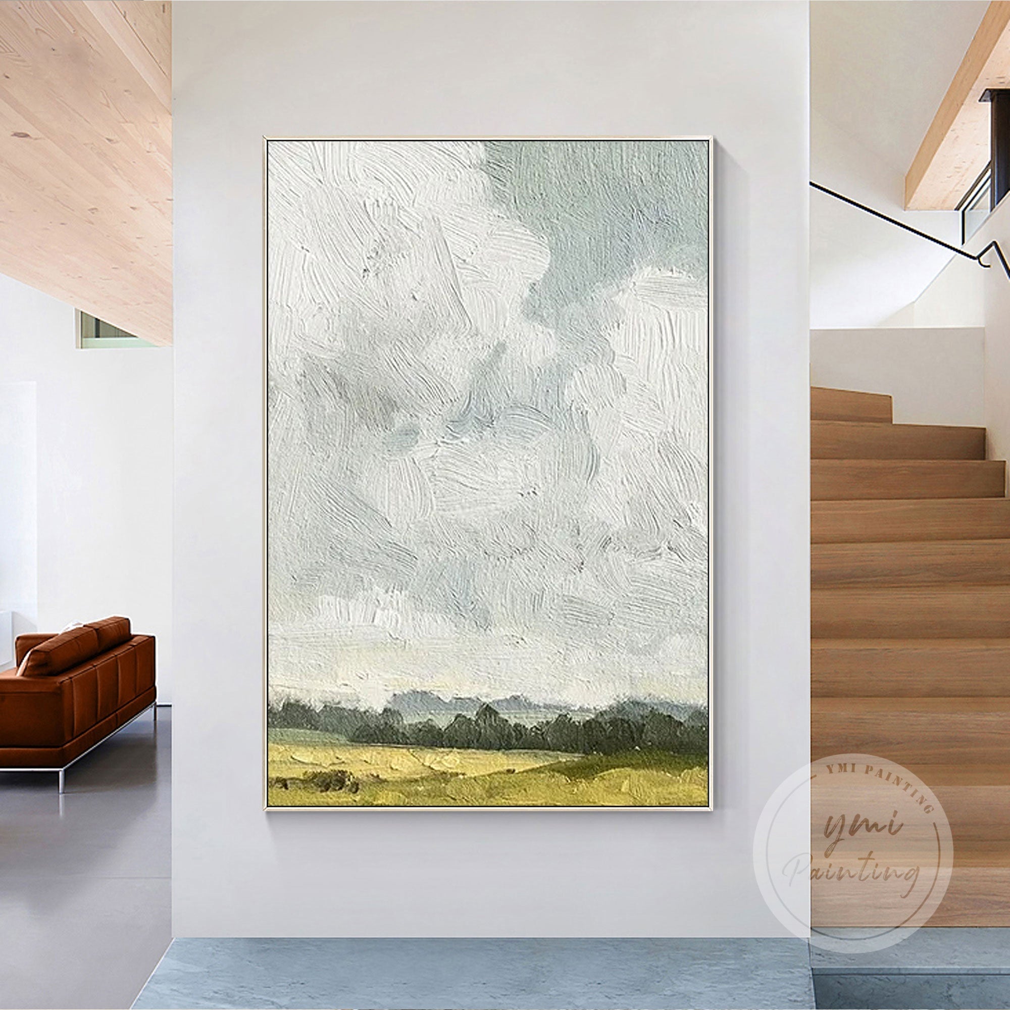 Calm field scene with neutral tones of green and blue.