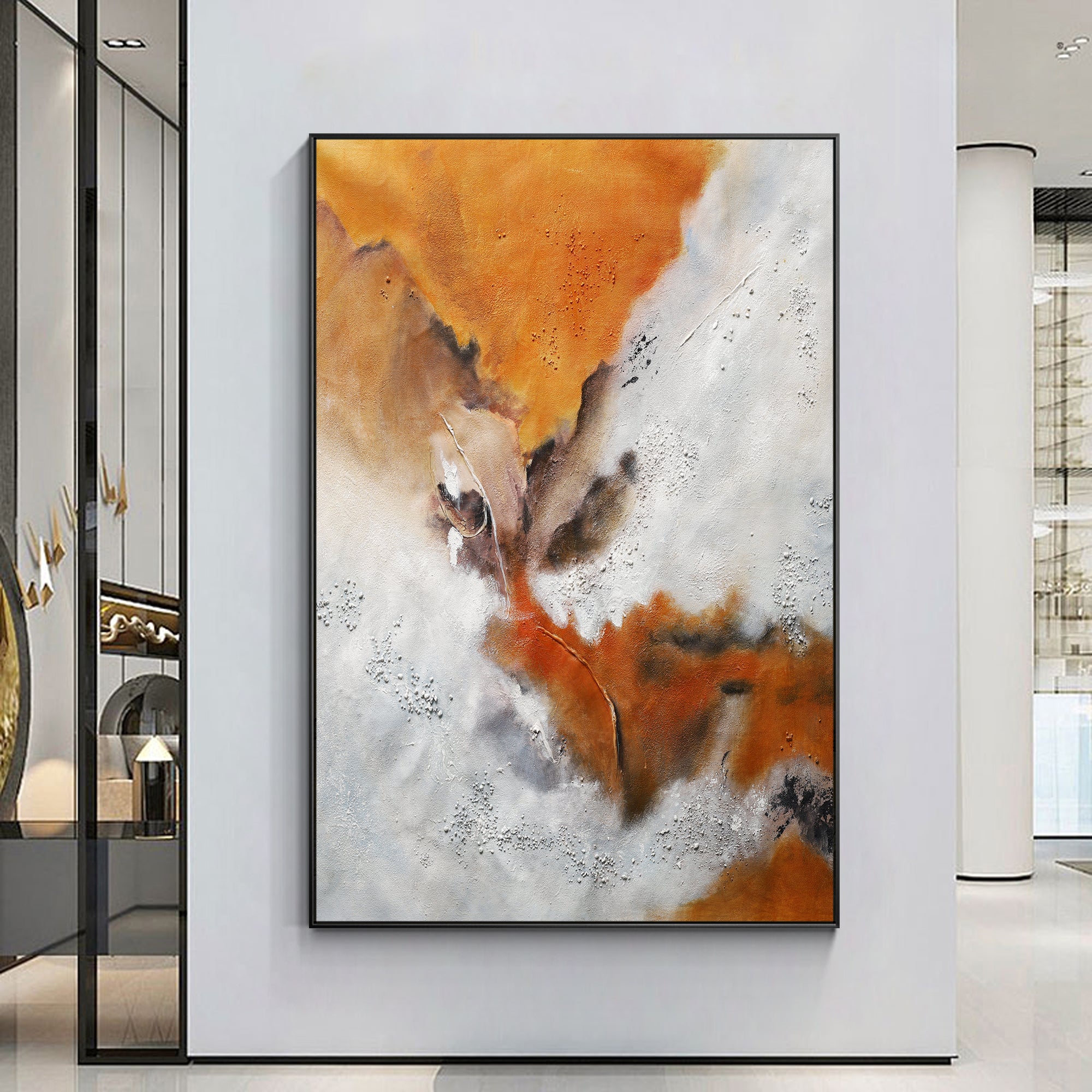 Orange white and brown abstract wall art displayed in a home entryway