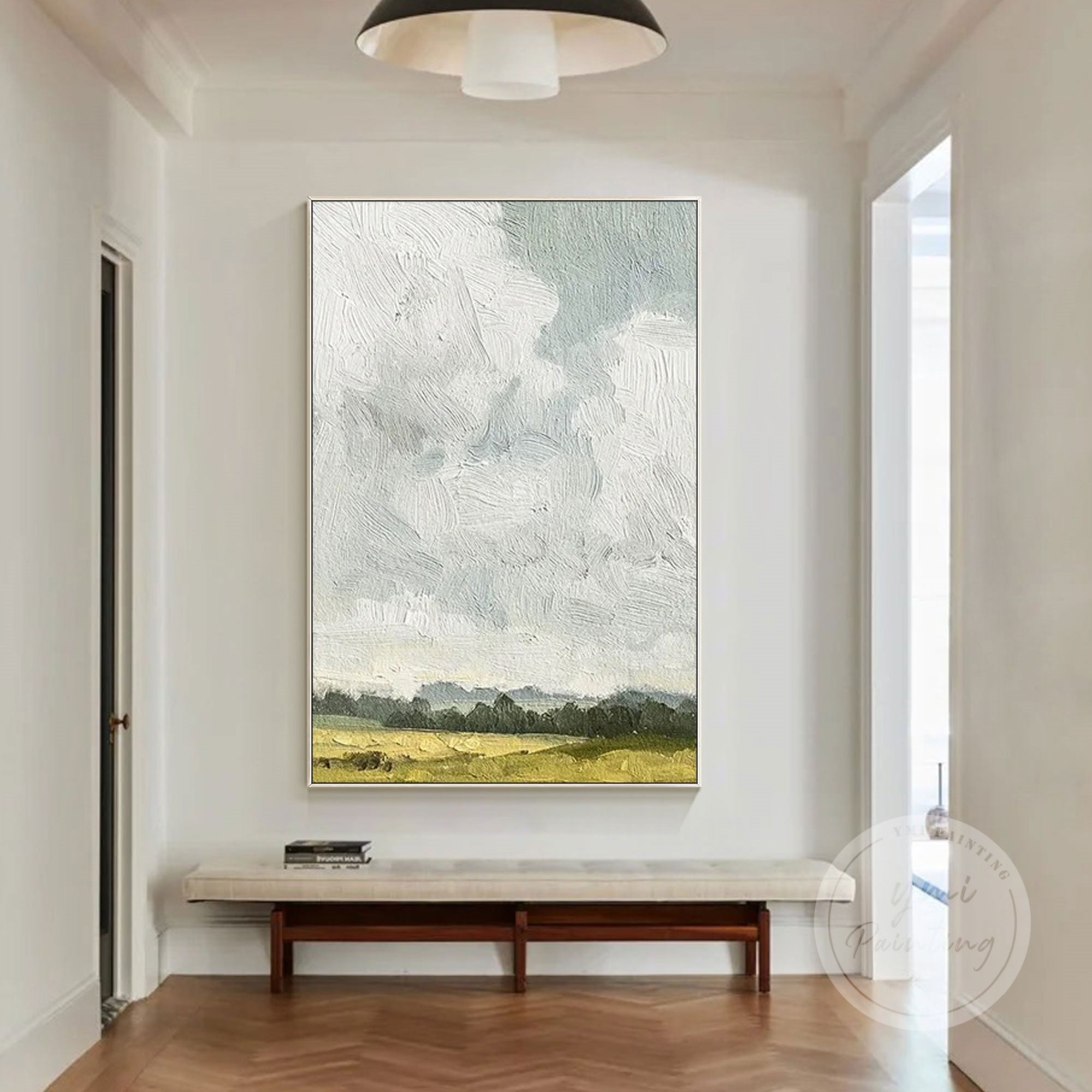 Peaceful minimalist painting of an open field under cloudy sky.