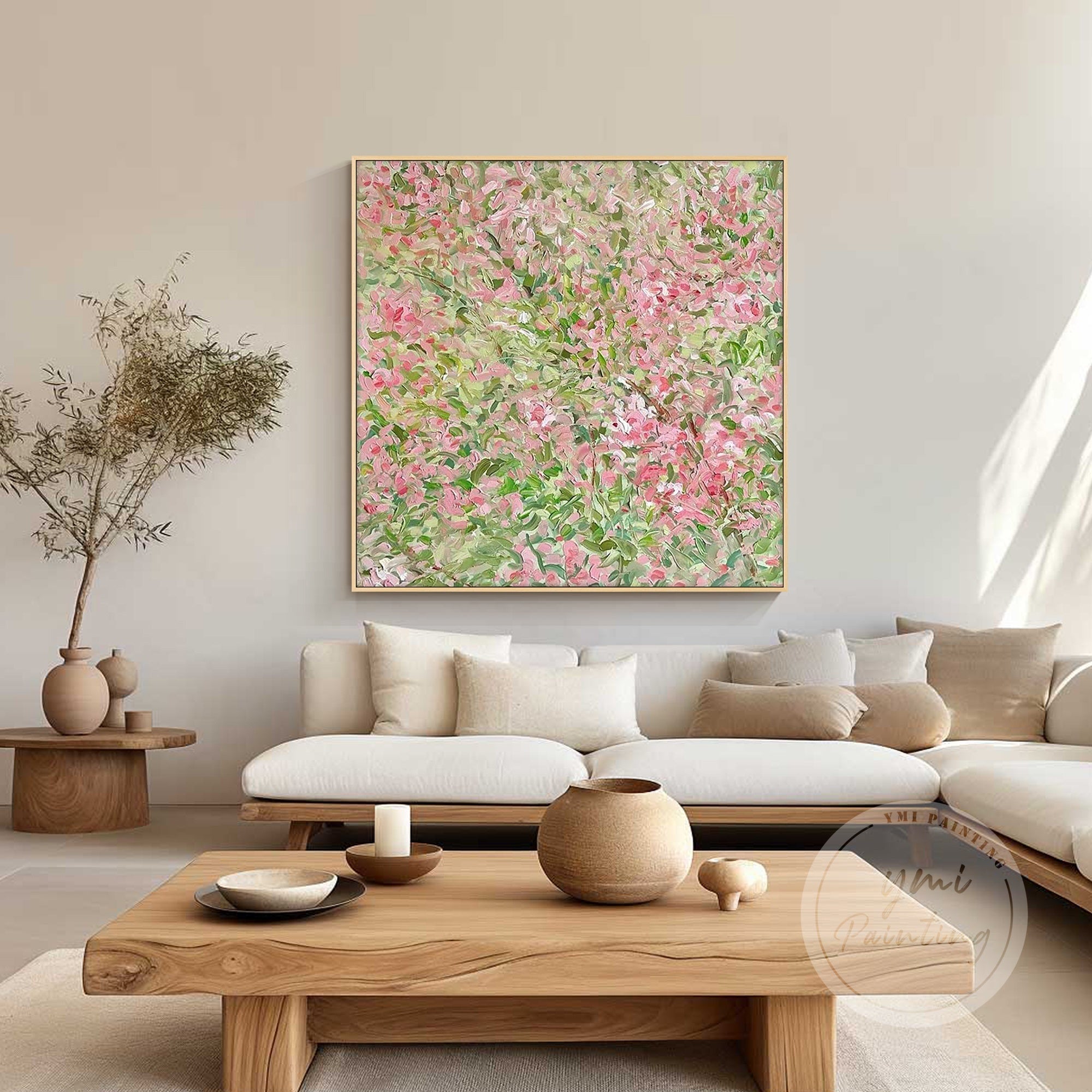 Vibrant oil painting of pink blossoms and green foliage with bold, expressive brushstrokes decorating a sunny and elegant living room.