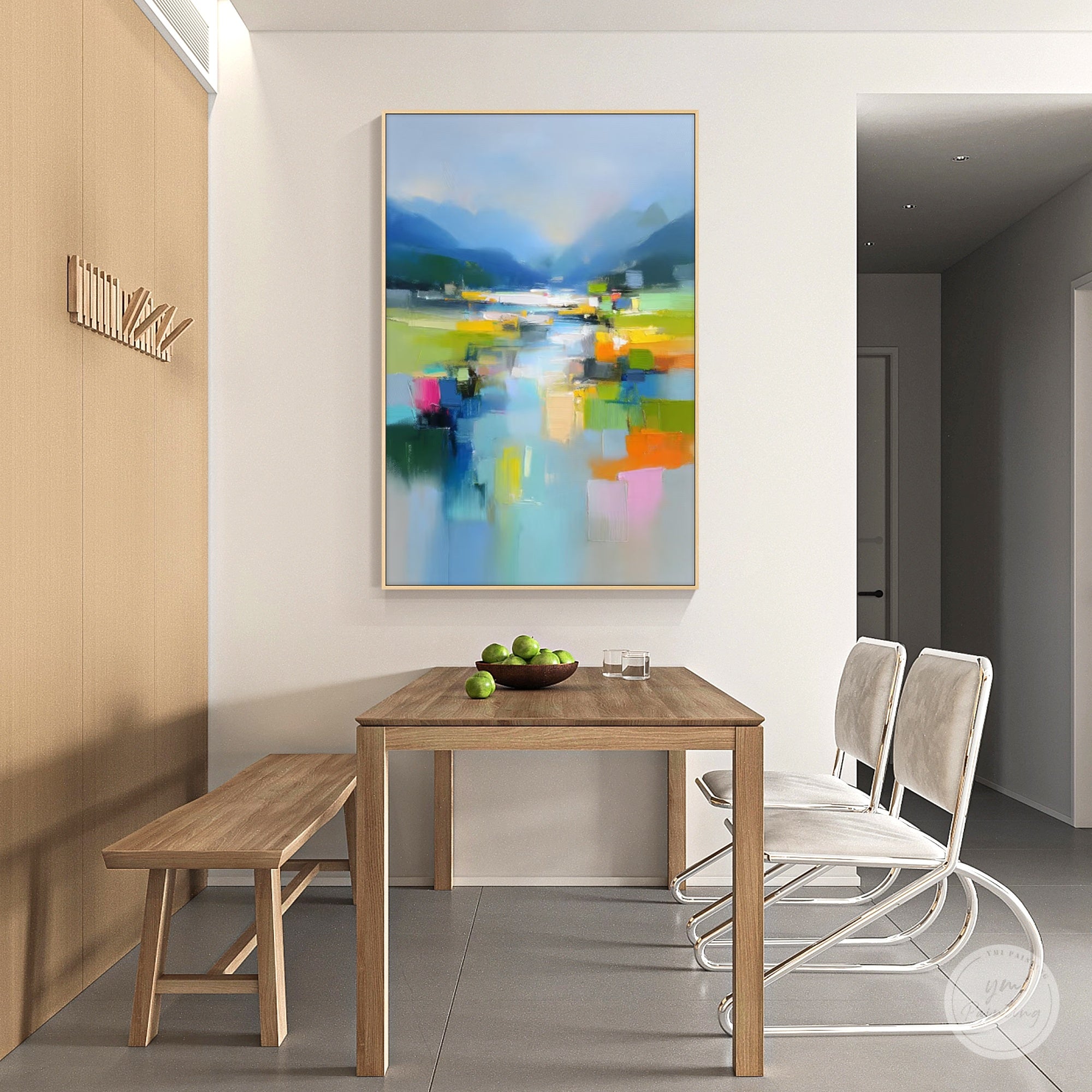 Riverside impressionist wall art featuring distant mountains in a living room