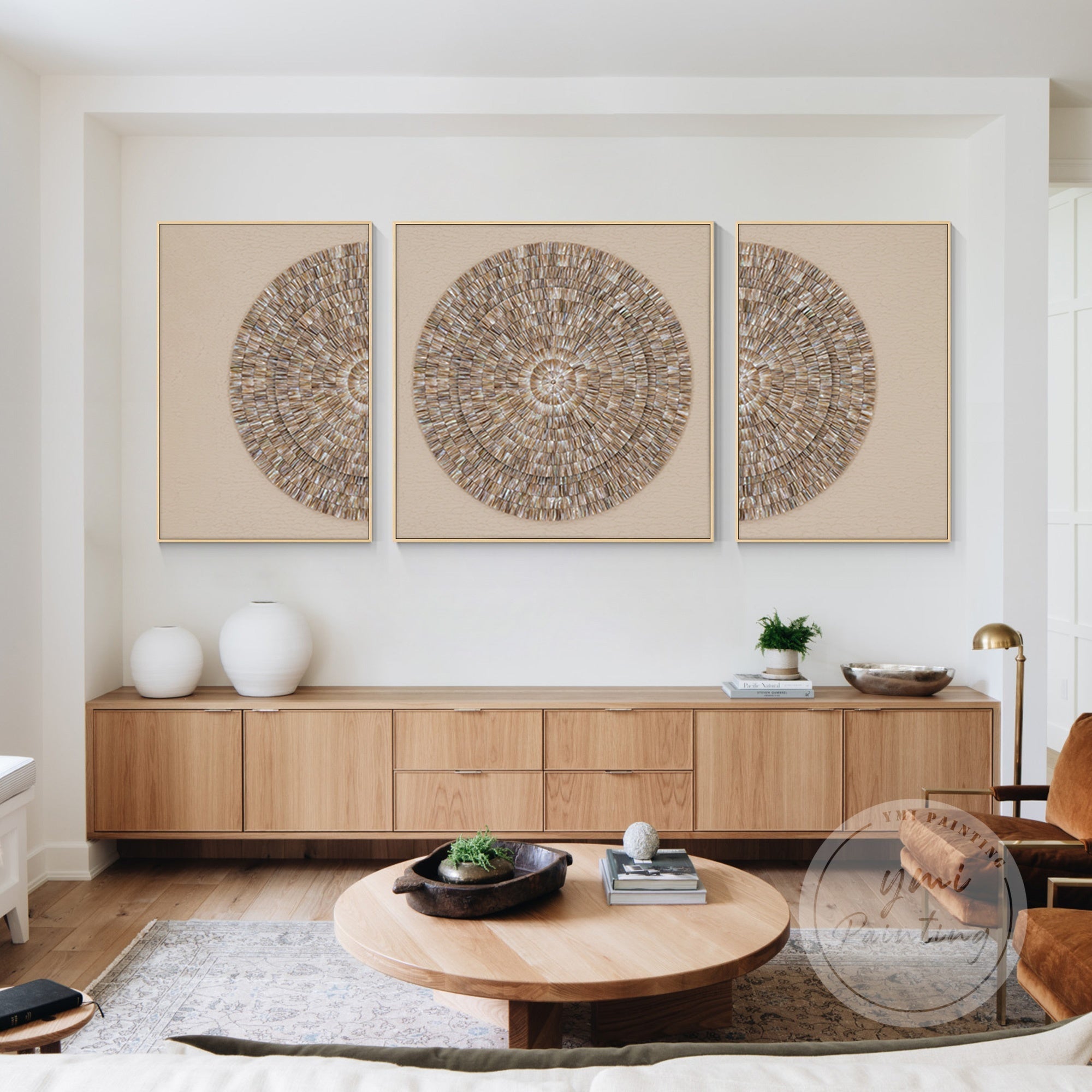 Set of 3 round oyster shell wall art pieces in layered beige tones.