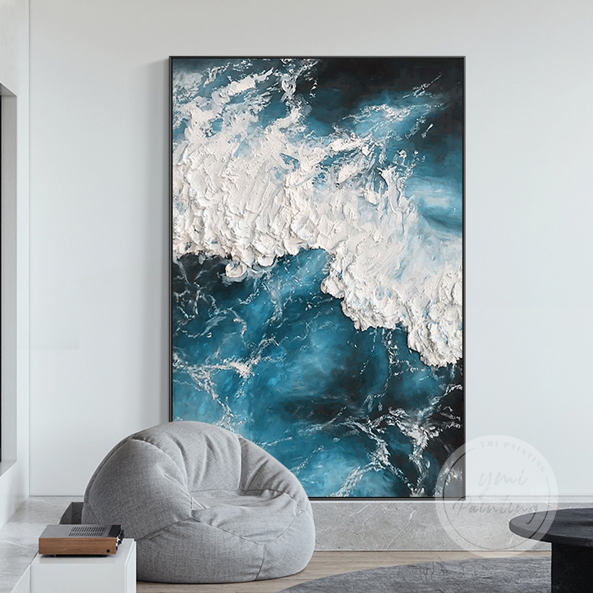 Coastal wall art with deep teal and blue tones, adding depth and movement to decor.