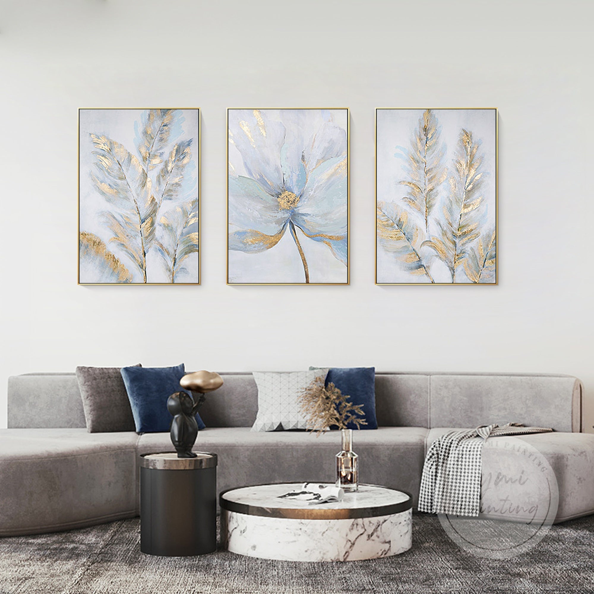 3-piece floral canvas set with gold and silver leaf accents in a minimalist living room