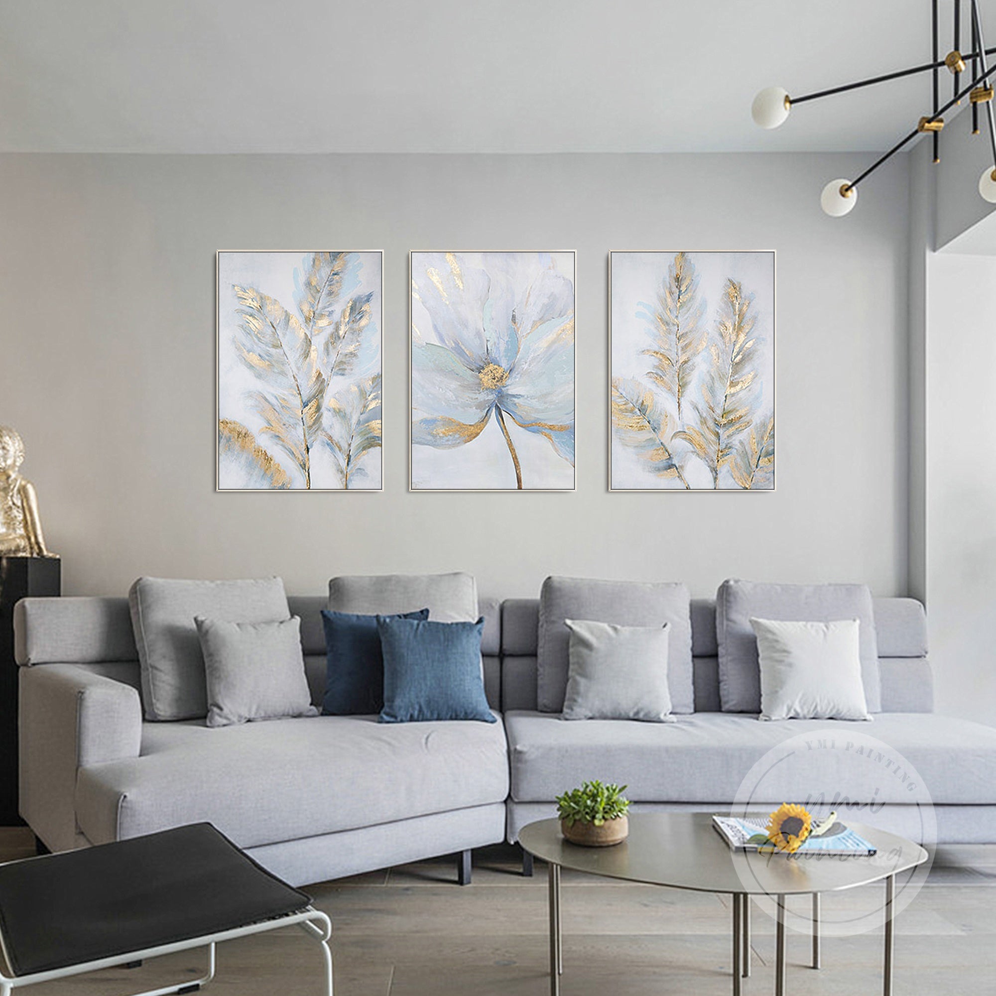 Elegant 3-piece canvas set with subtle texture and metallic accents above a cozy sofa