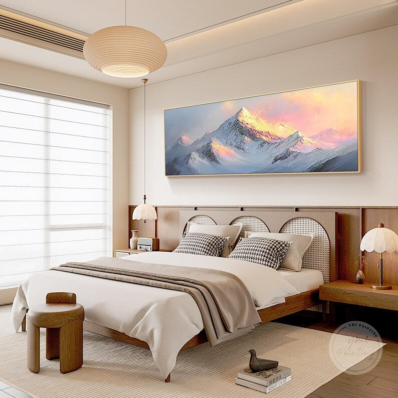 Horizontal snow mountain sunrise painting hanging above a sofa, refined housewarming gift