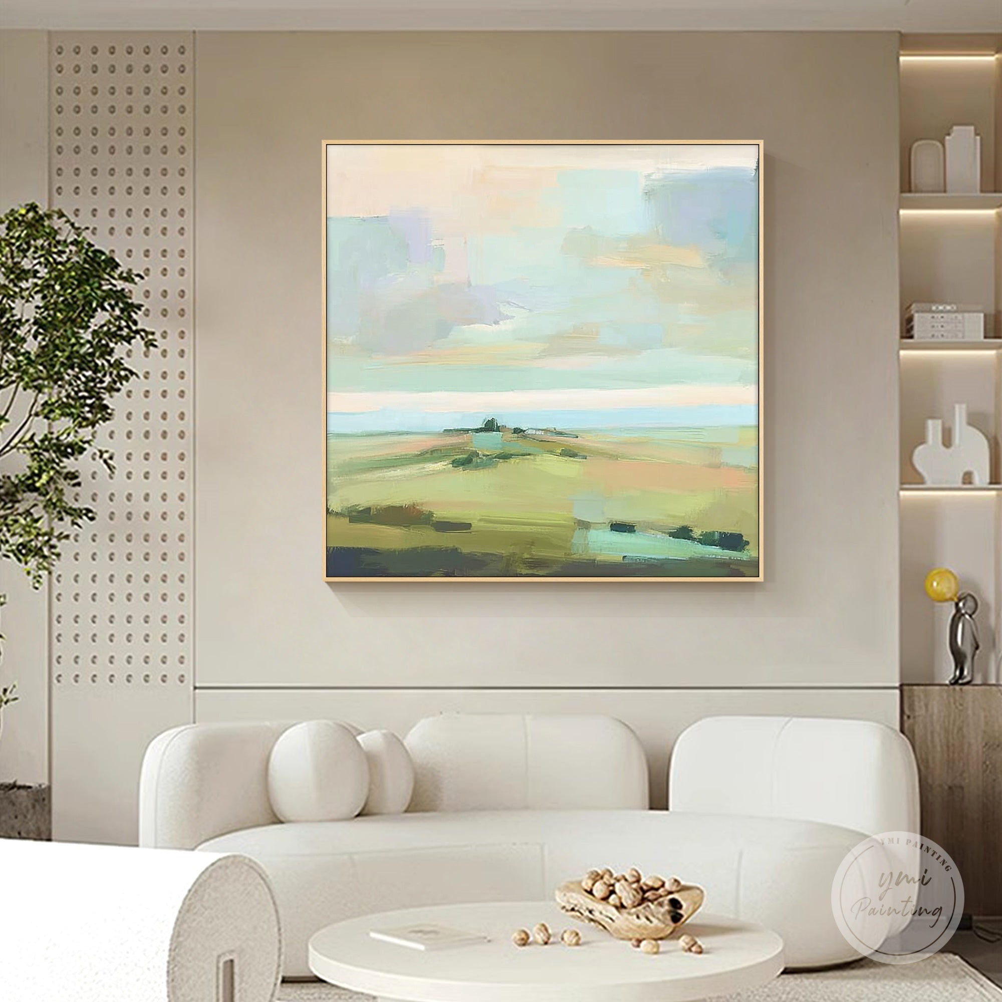 Square abstract pastel landscape painting styled above a sofa in a contemporary living room