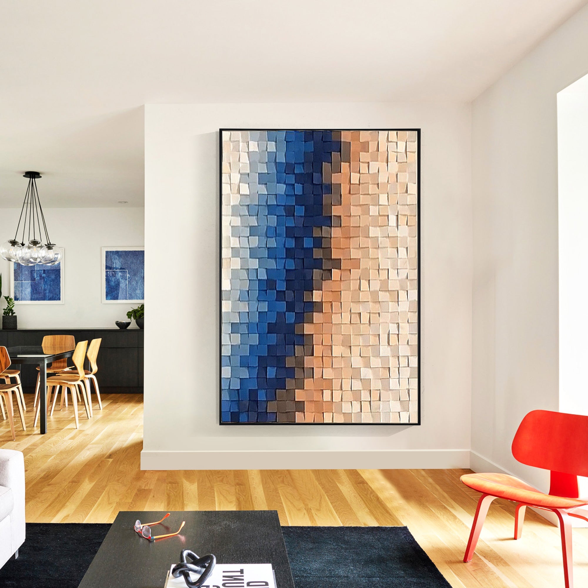 Abstract wall art with natural wood squares, creating a smooth gradient from blue to peach against a white backdrop, decoring the mordern living room.