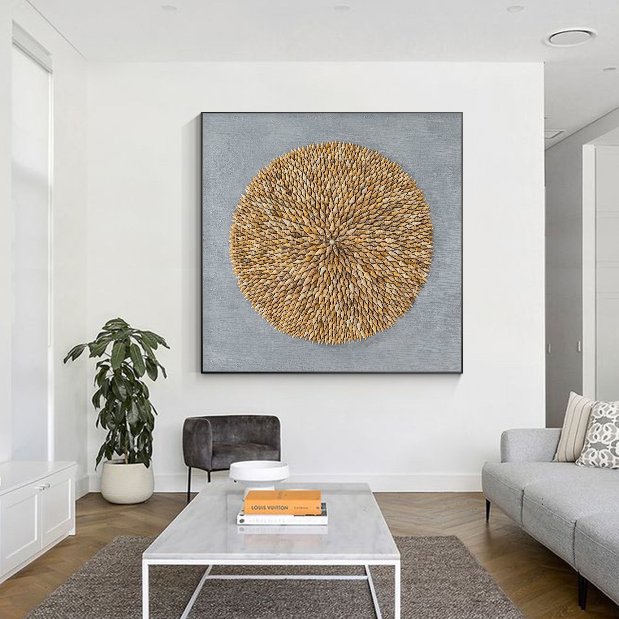 Spiral shell mosaic wall art with pearl centerpiece and natural textures.