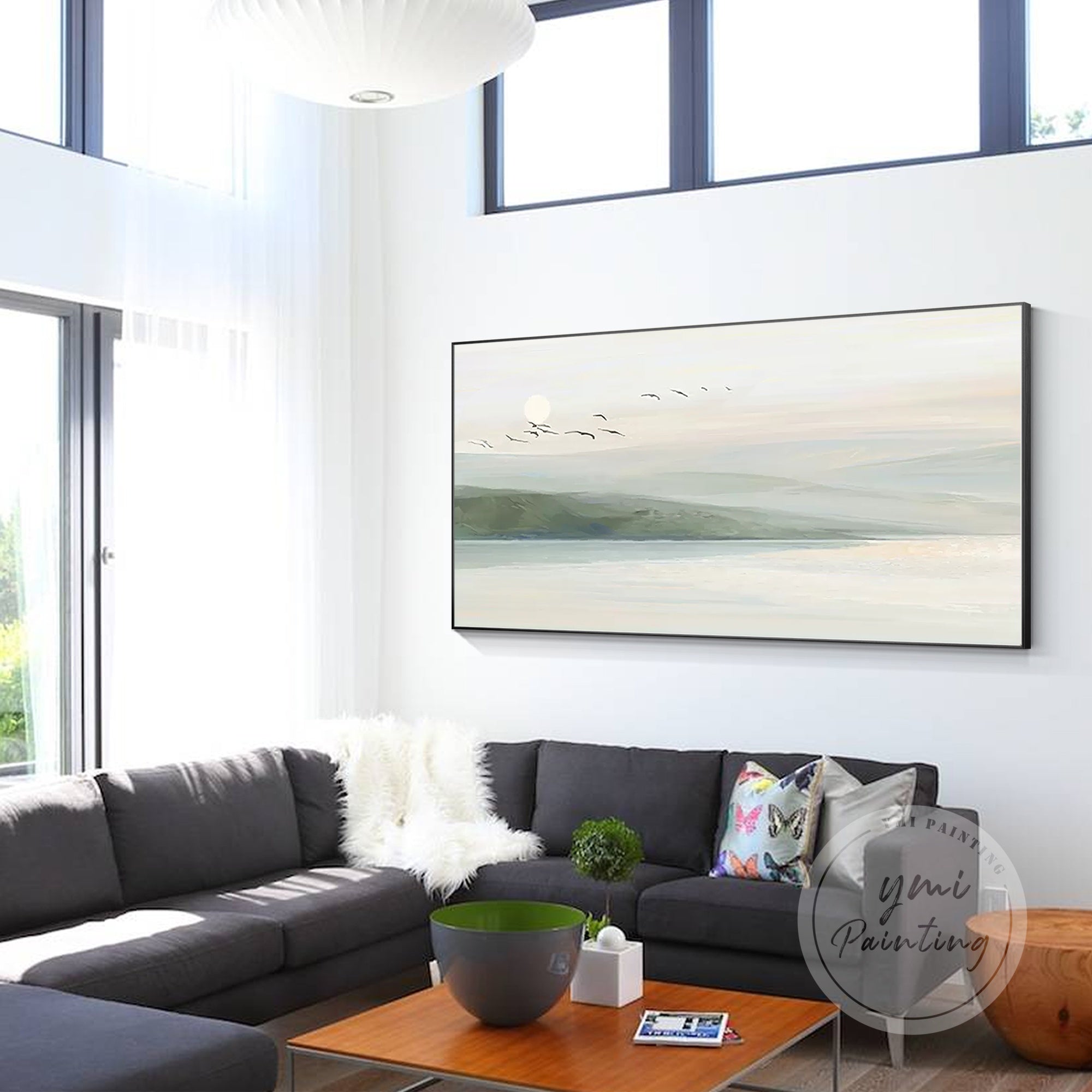 Tranquil painting of rolling hills and serene waters with light green, gray, and blue hues.