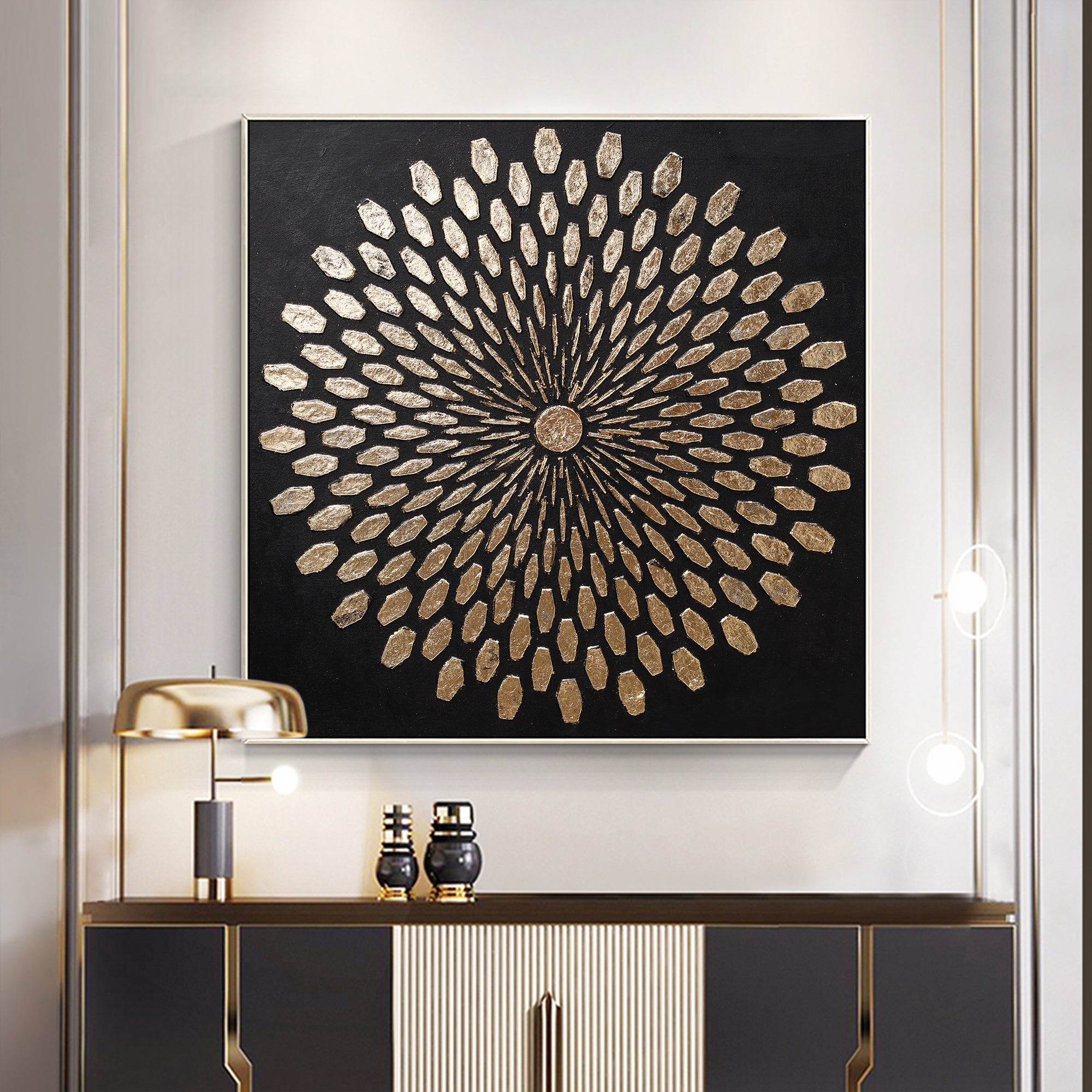 Textured black and gold wall art styled over a modern sideboard