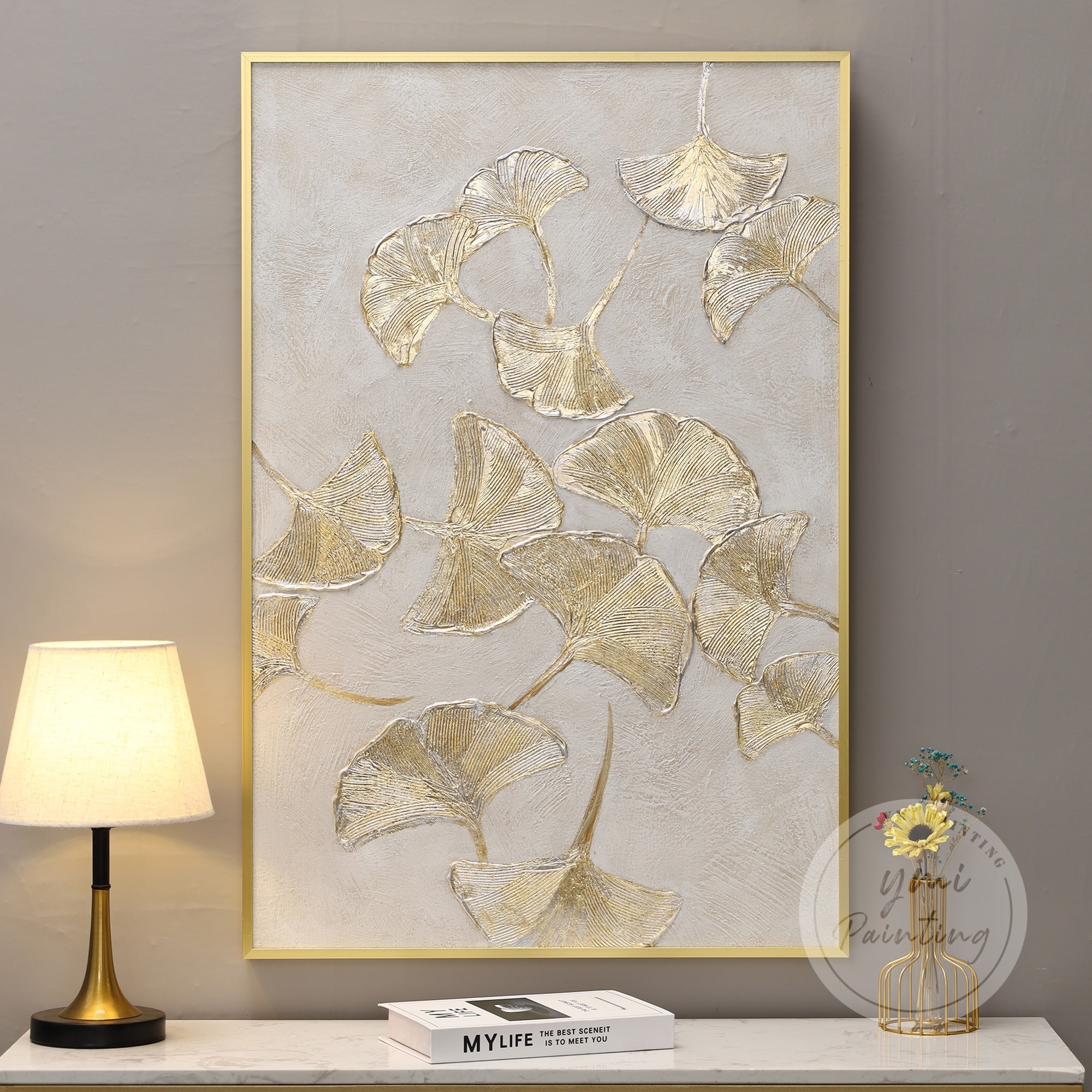 Abstract Ginkgo leaf artwork with minimalist aesthetic, blending gold leaf with soft, neutral tones for a calming atmosphere.