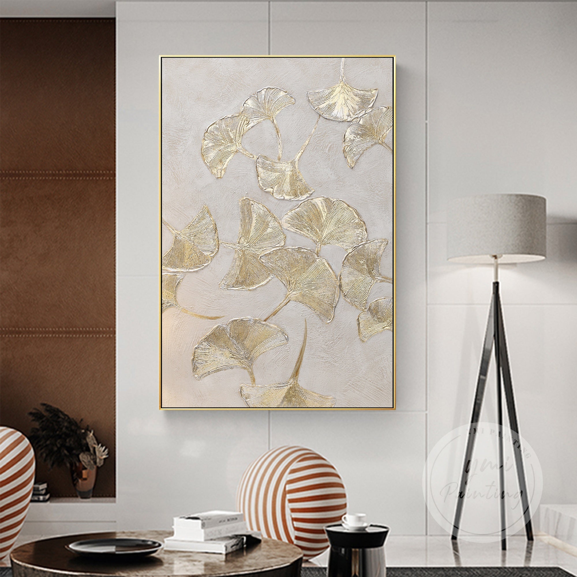 Elegant Ginkgo Biloba leaf wall art, featuring a minimalist design and striking gold leaf accents on a neutral canvas.